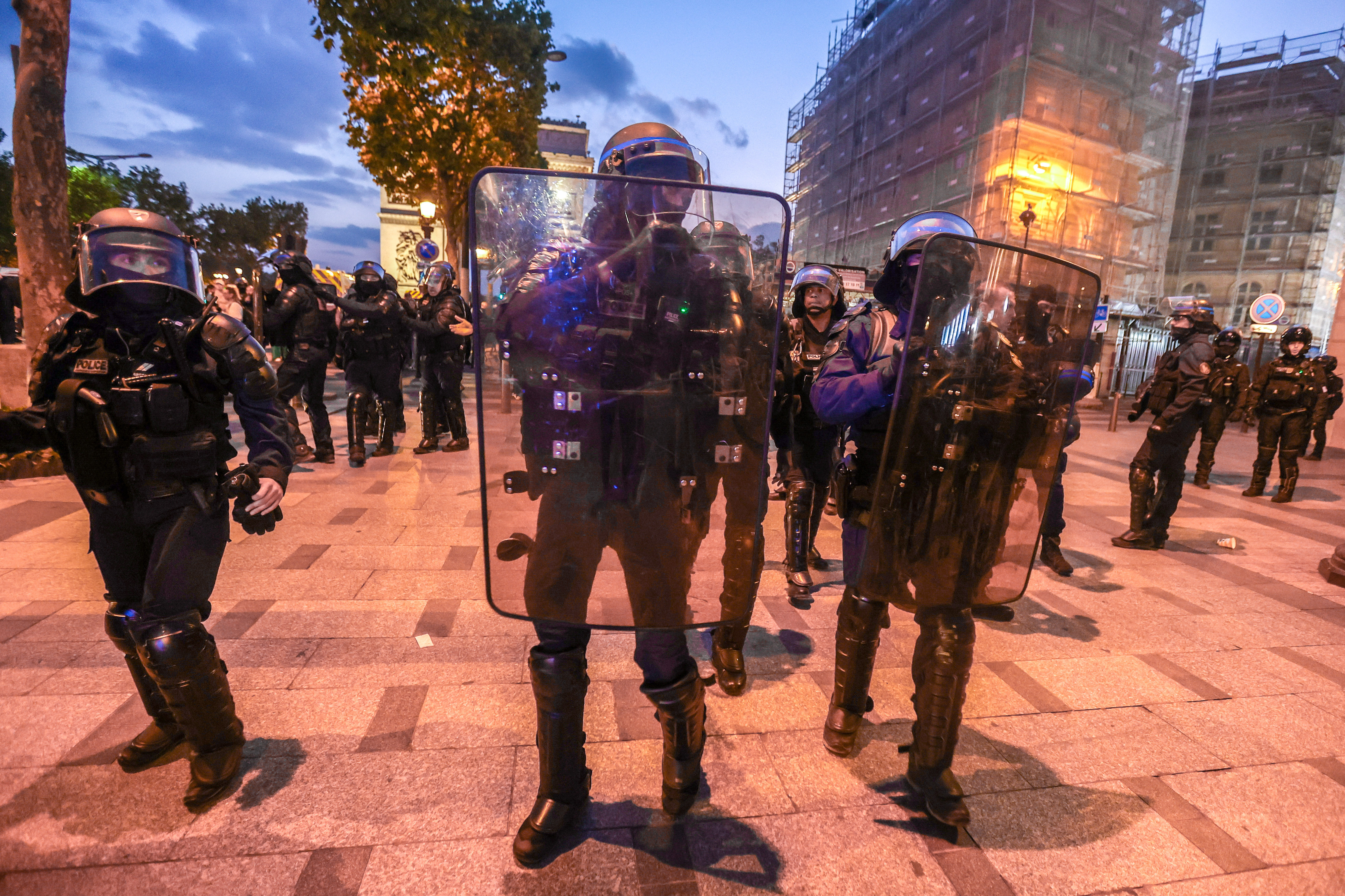 Riot police forces secure the area in front of the Arc de triomphe amid fears of another night of clashes with protestors in Paris