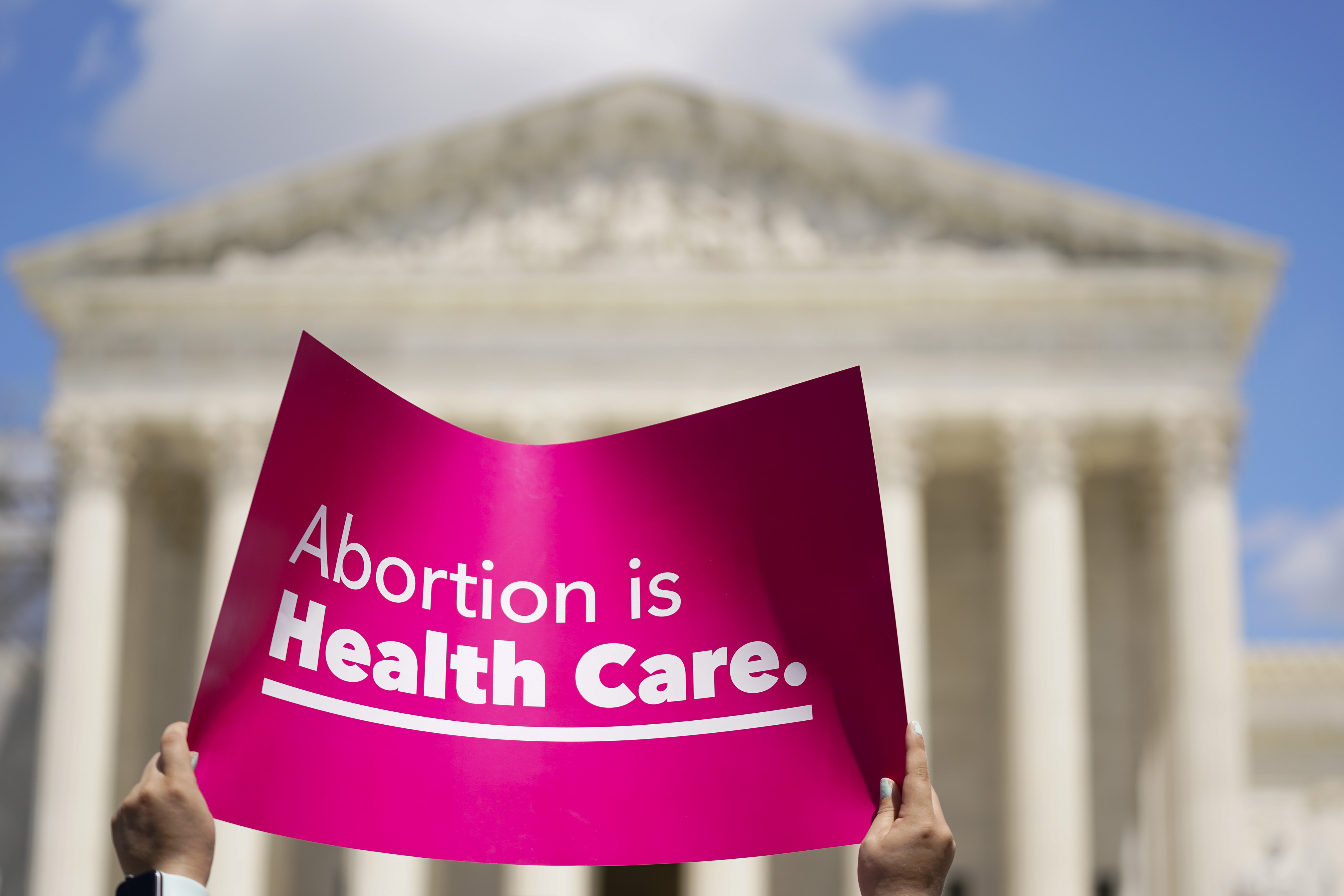 Pink sing in front of Supreme Court says: Abortion is Healthcare