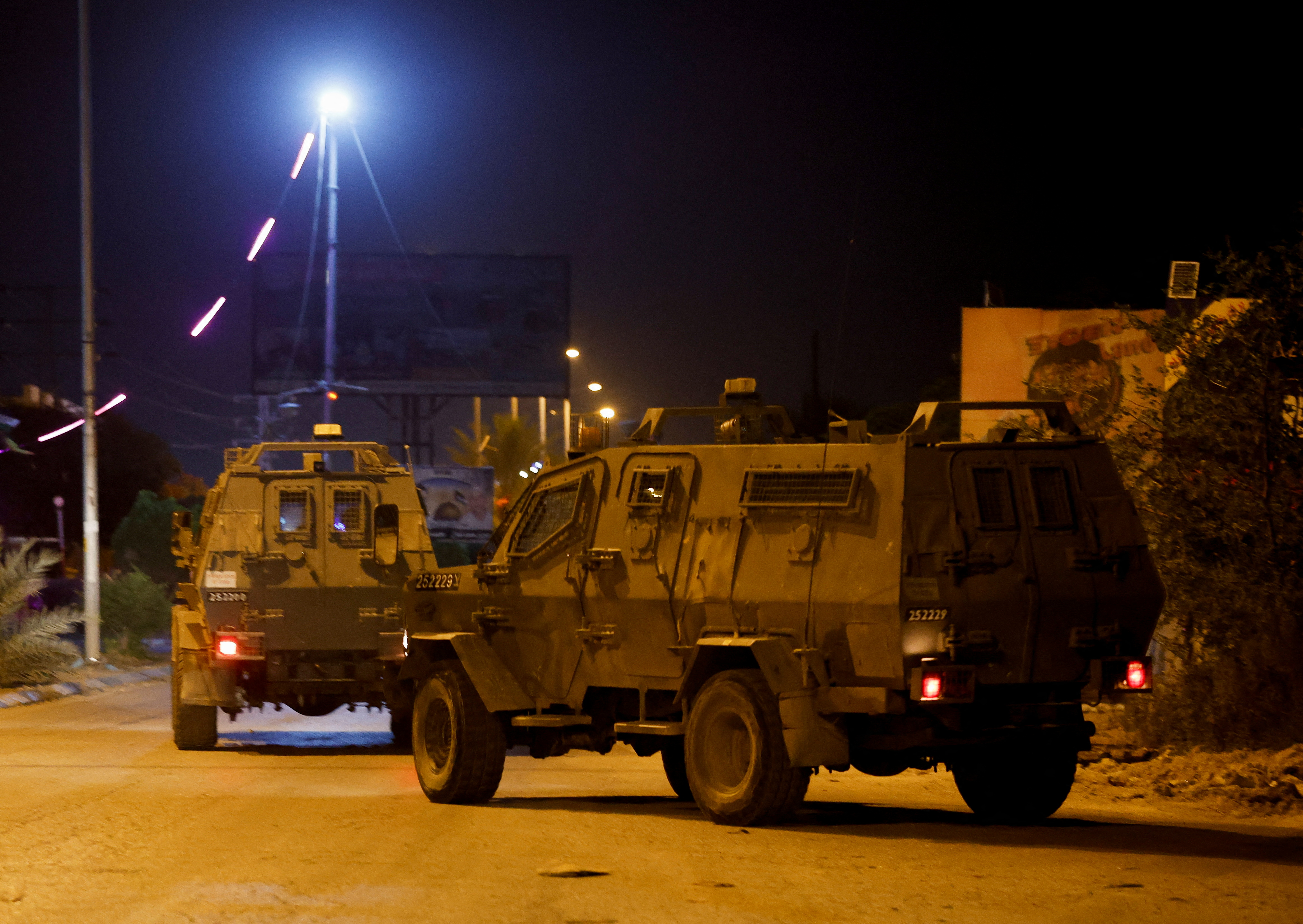 Israeli military vehicles operate in Jericho, in the Israeli-occupied West Bank May 25, 2023. REUTERS/Ammar Awad