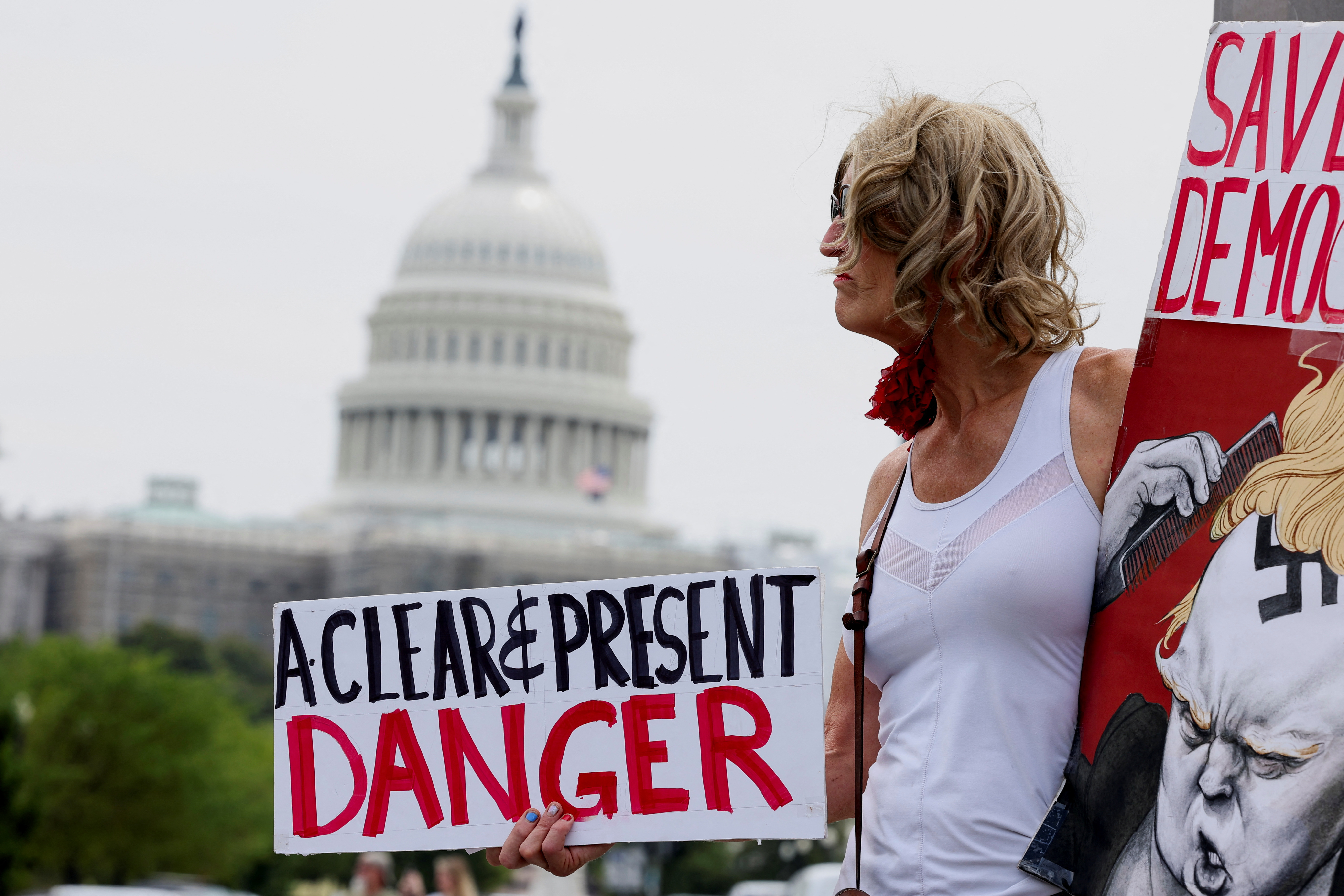 Nicky Sundt stands on the corner of Pennsylvania and Constitution Avenue in front of the federal courthouse