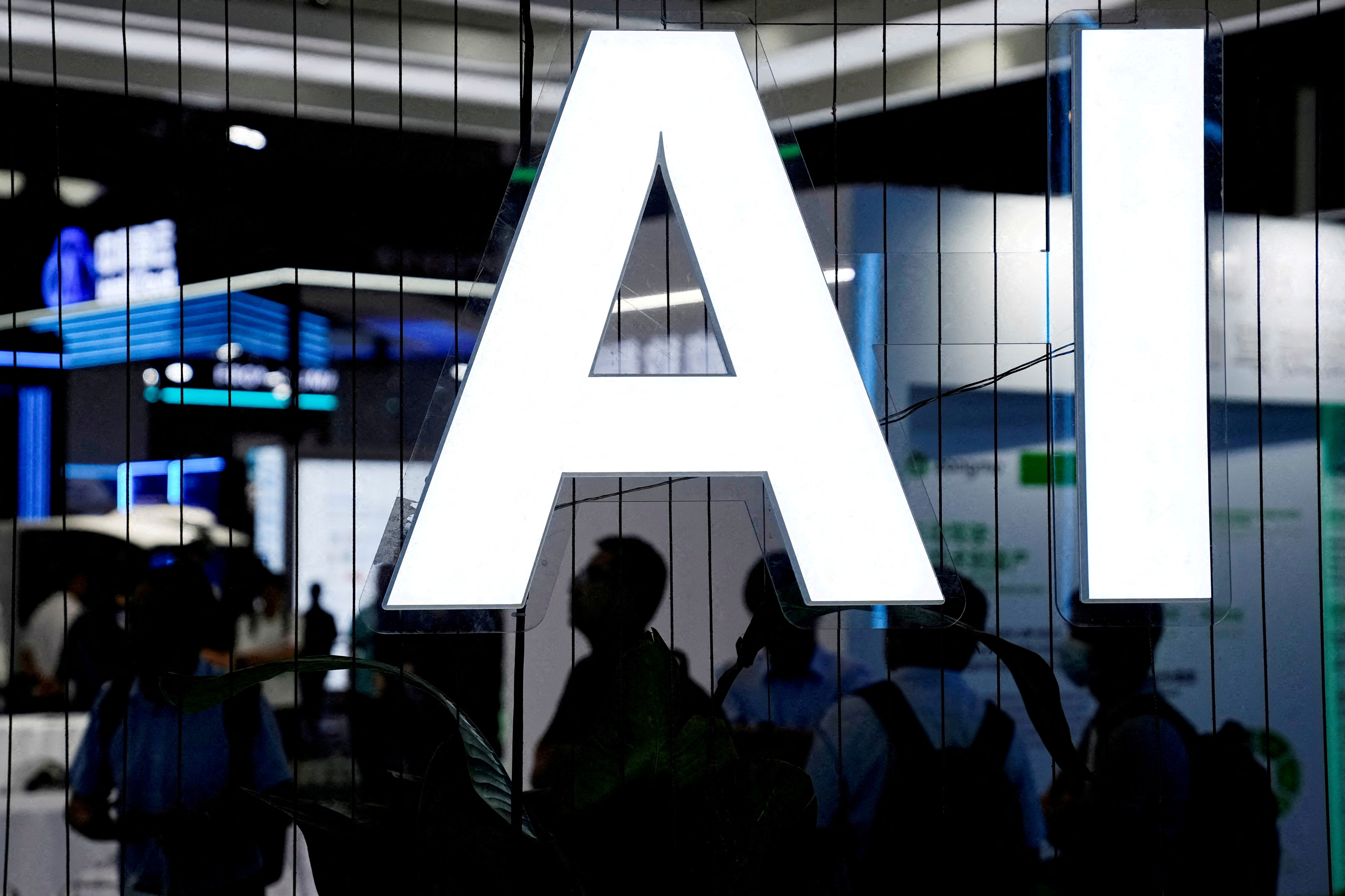 FILE PHOTO: An AI (Artificial Intelligence) sign is seen at the World Artificial Intelligence Conference (WAIC) in Shanghai, China July 6, 2023. REUTERS/Aly Song/File Photo