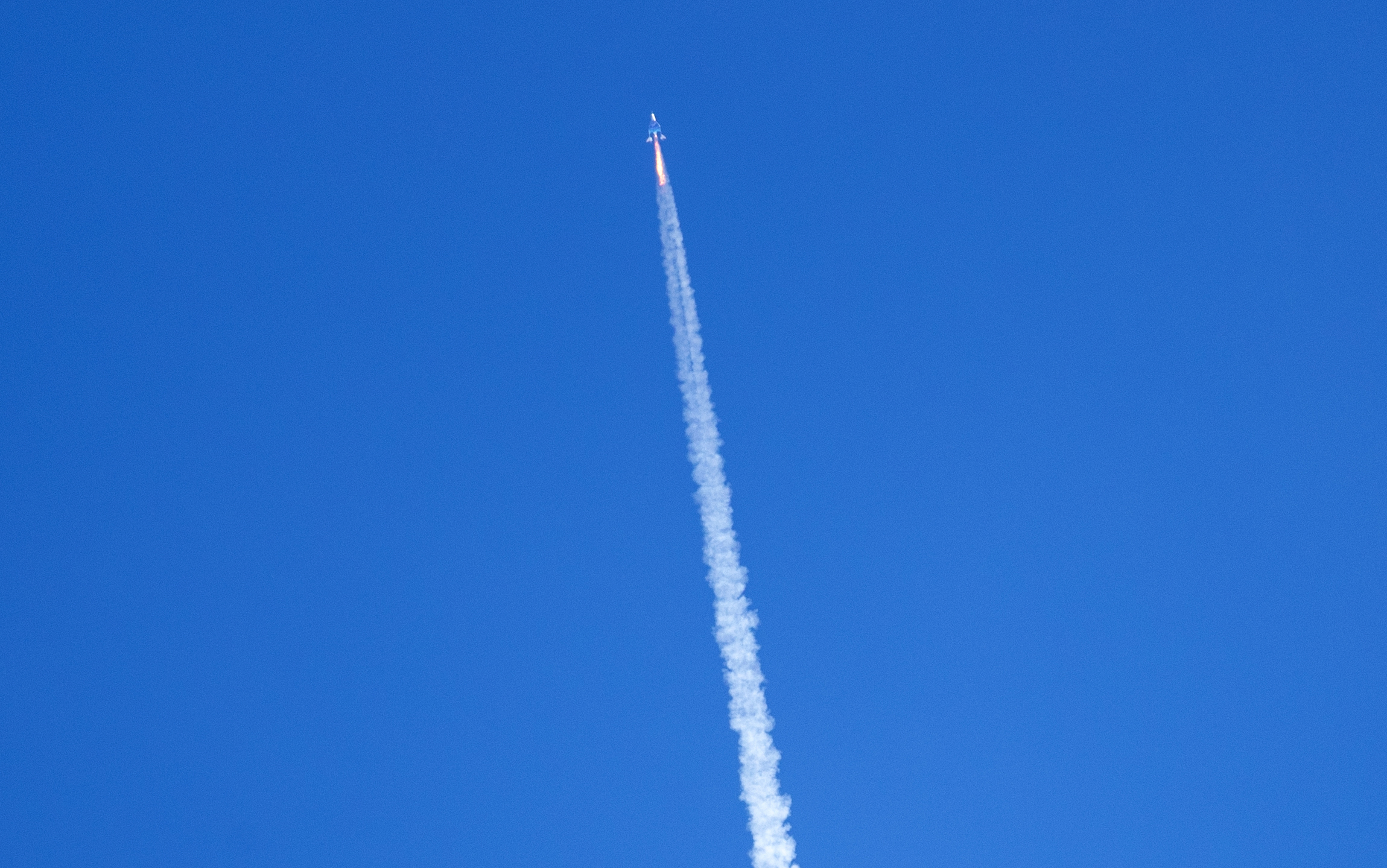 Virgin Galactic's rocket-powered plane Unity 22, flies on its way to the edge of space after taking off from Spaceport America, near Truth or Consequences, N.M., US
