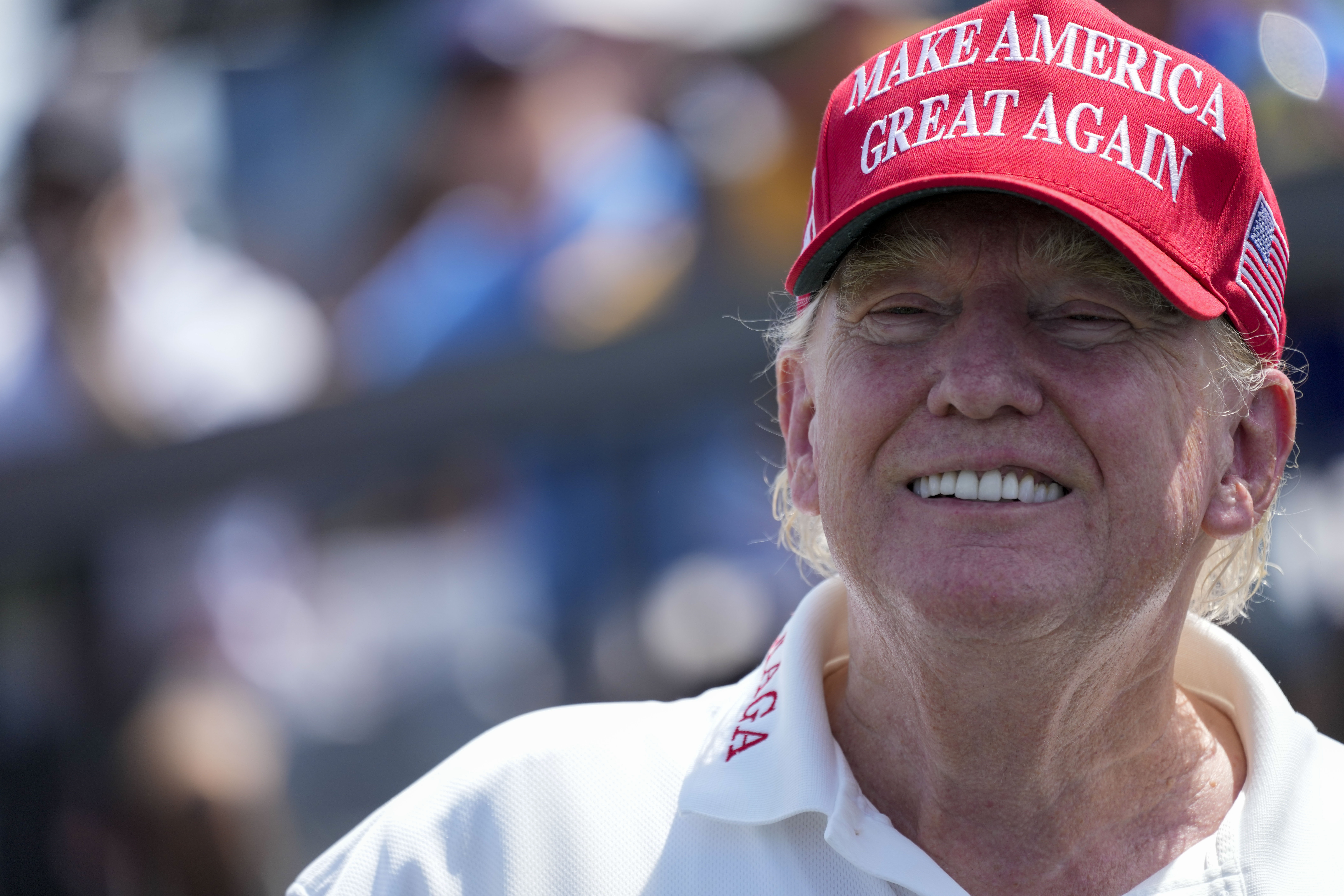 Former President Donald Trump watches the first round of the Bedminster Invitational LIV Golf tournament in Bedminster, N.J., Friday, Aug. 11, 2023.