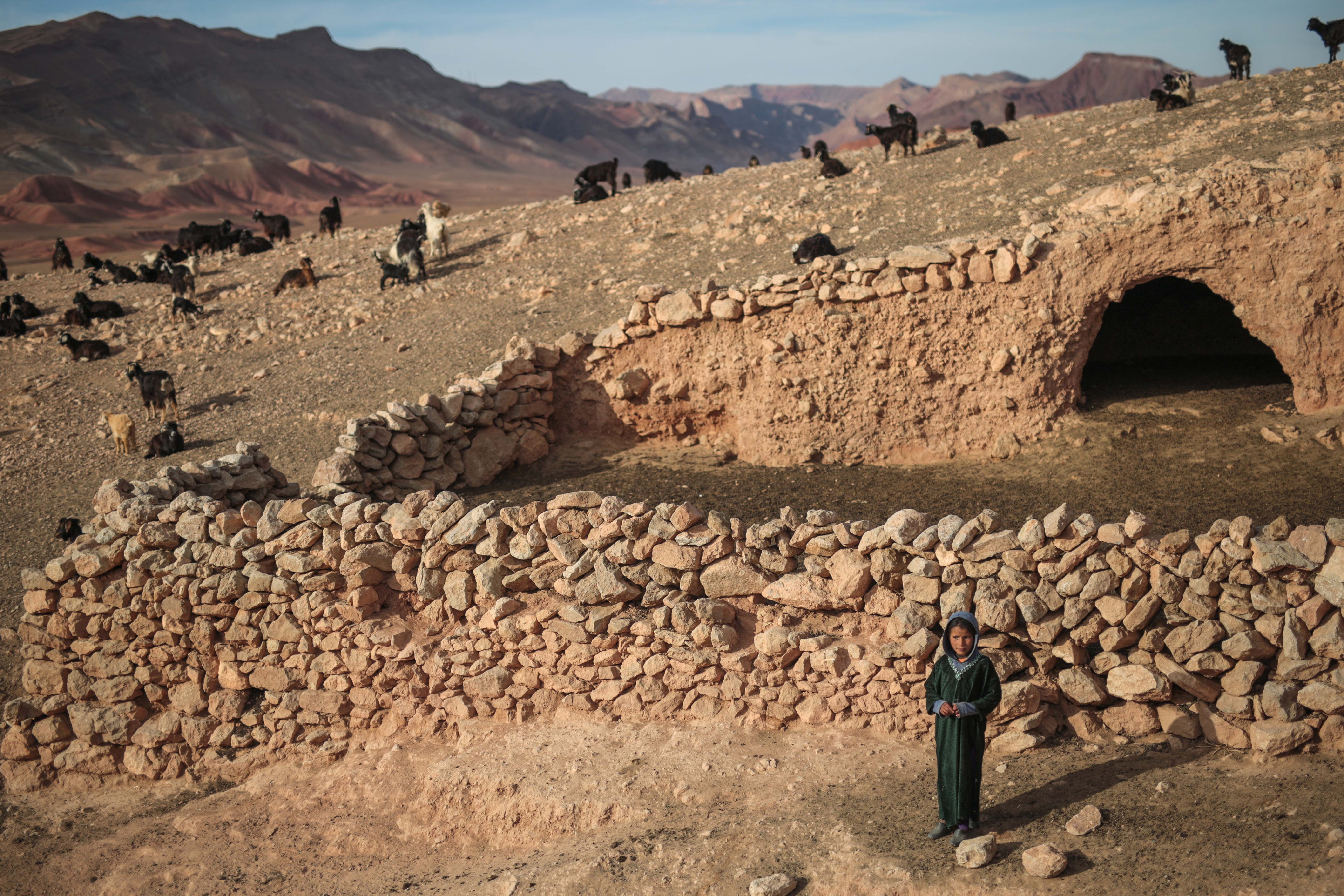 Amazigh child outside a cave