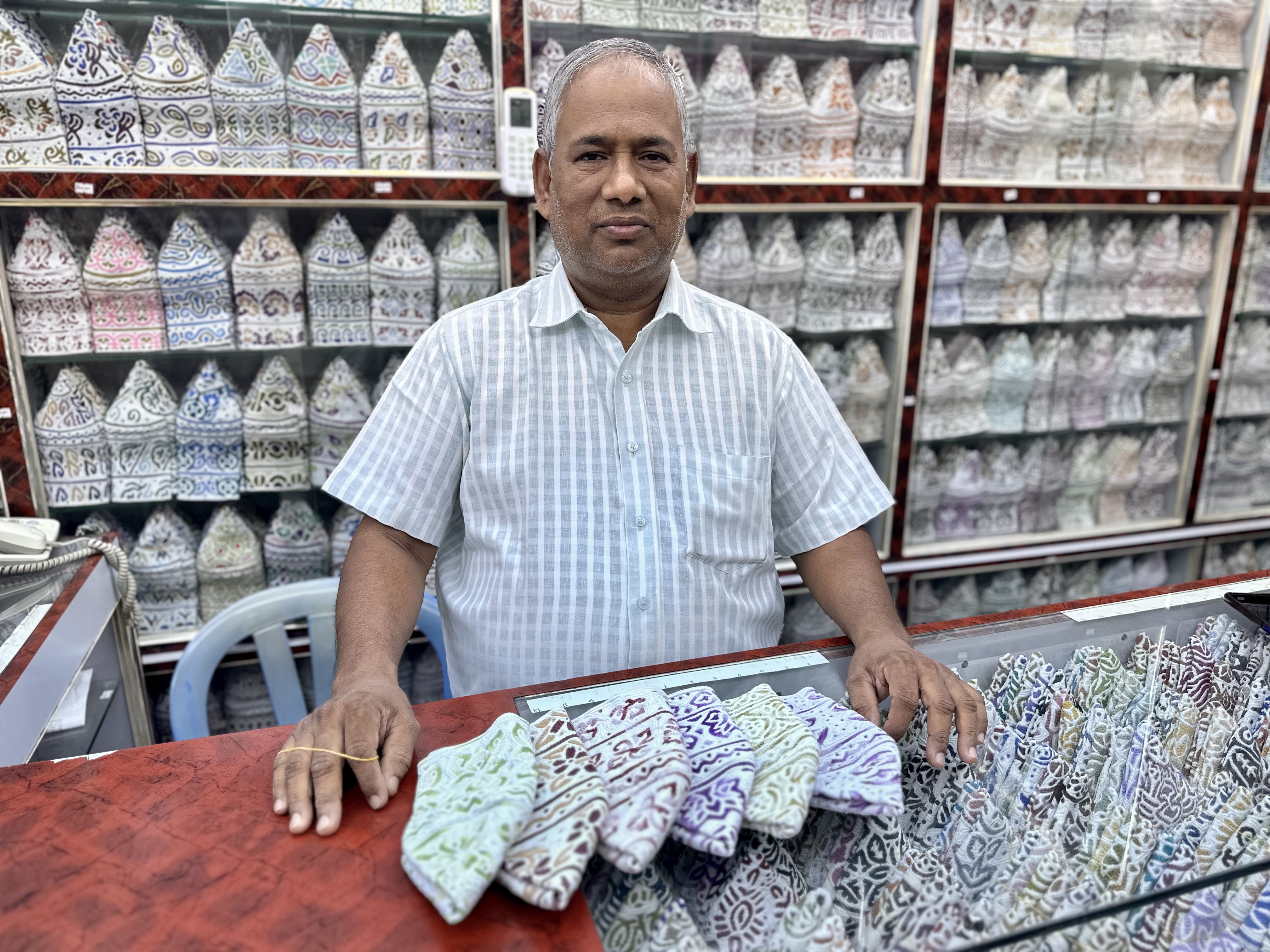 Hossein sells the kummah in the souq