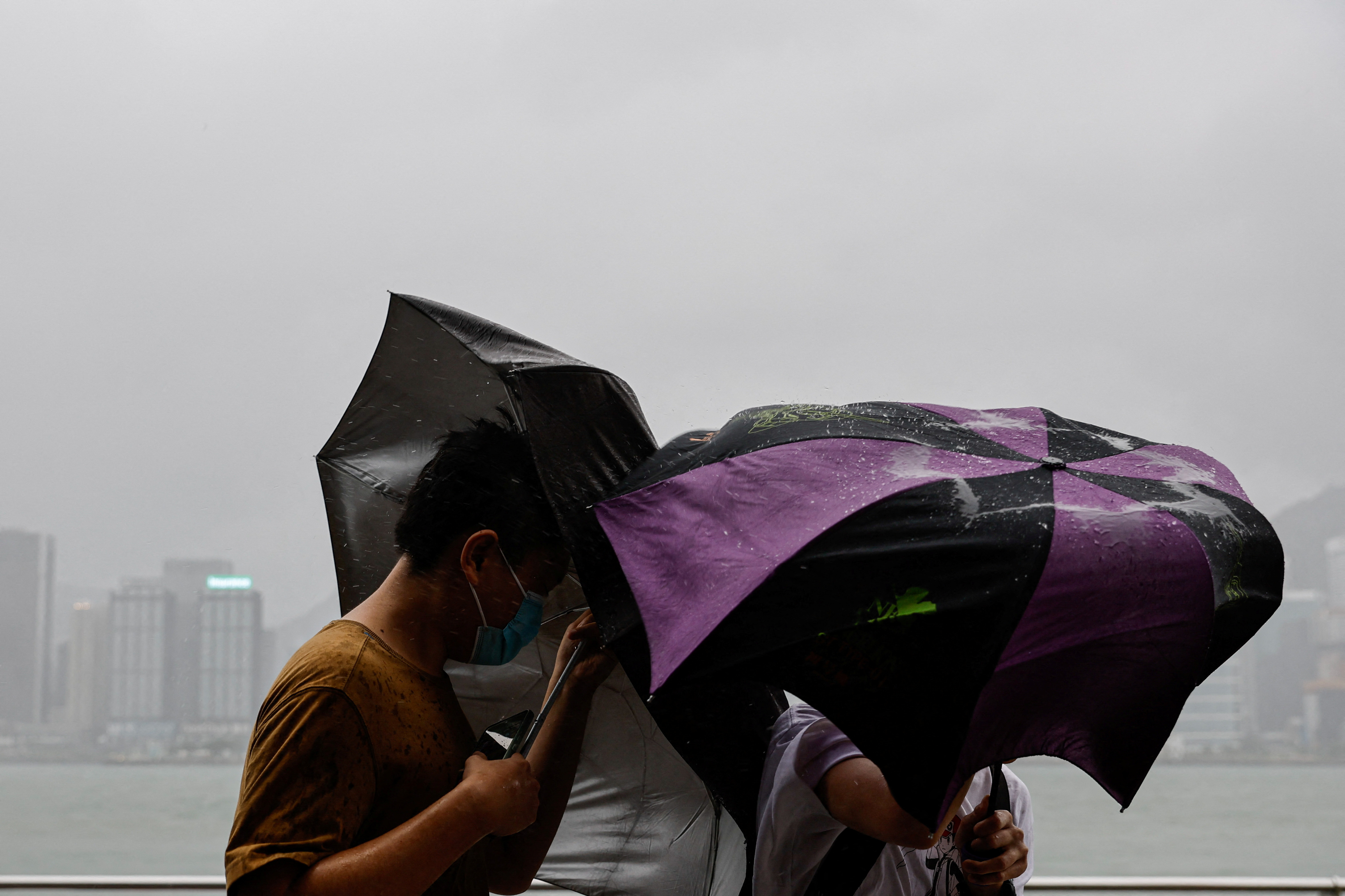 People brave strong winds as Super Typhoon Saola approaches Hong Kong