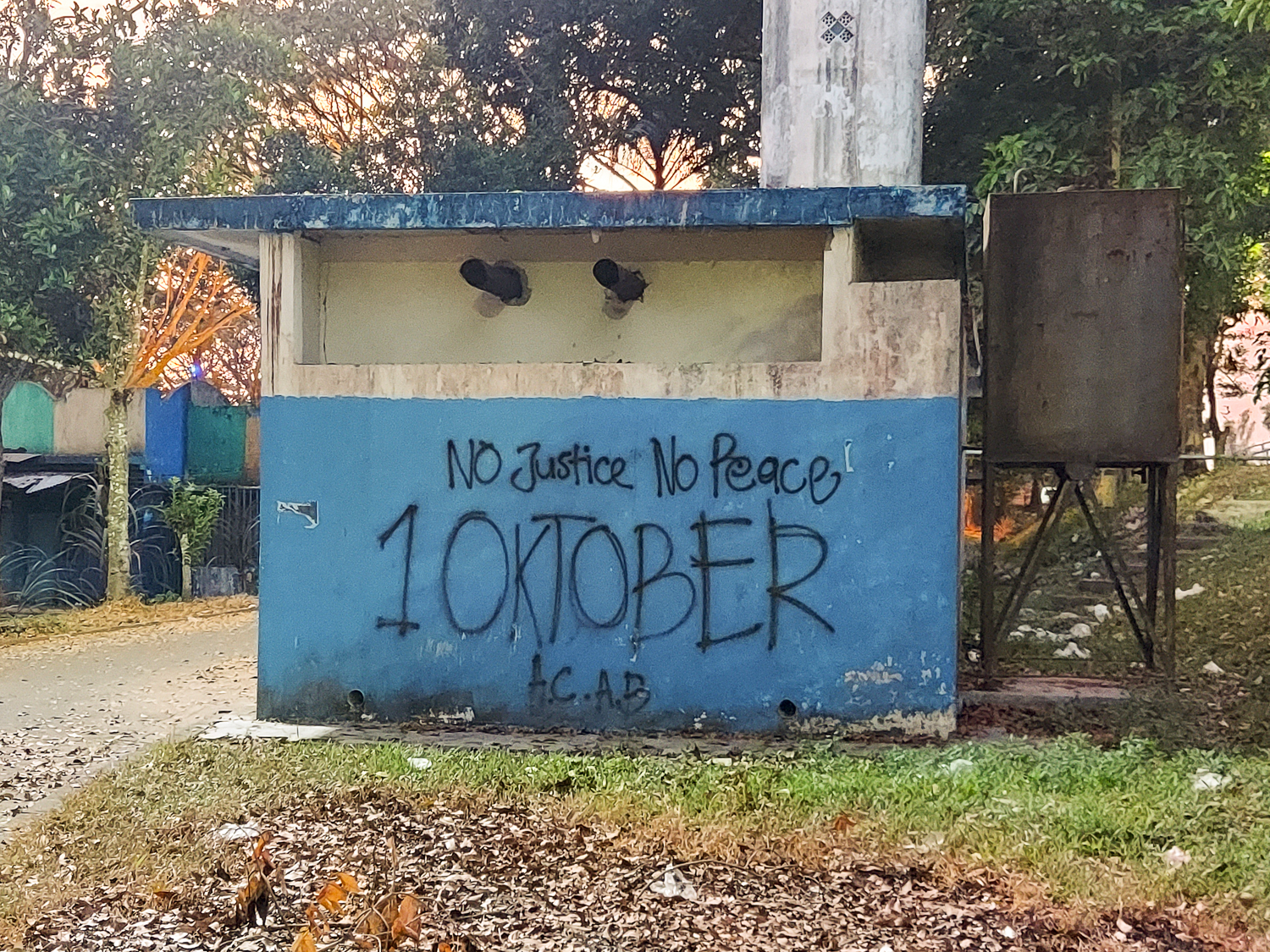 Graffiti scrawled on buildings at the stadium expresses a lack of justice following the tragedy