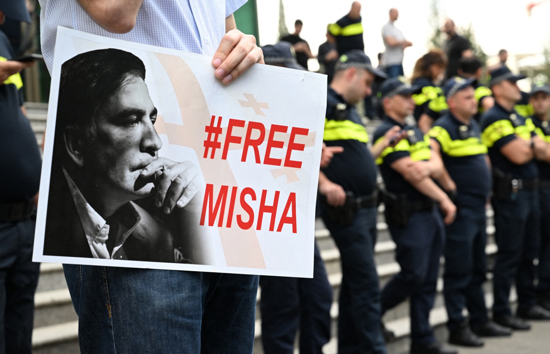 Supporters of Georgia's jailed ex-president Mikheil Saakashvili rally outside a clinic, where the politician is being held, to demand his liberation in Tbilisi