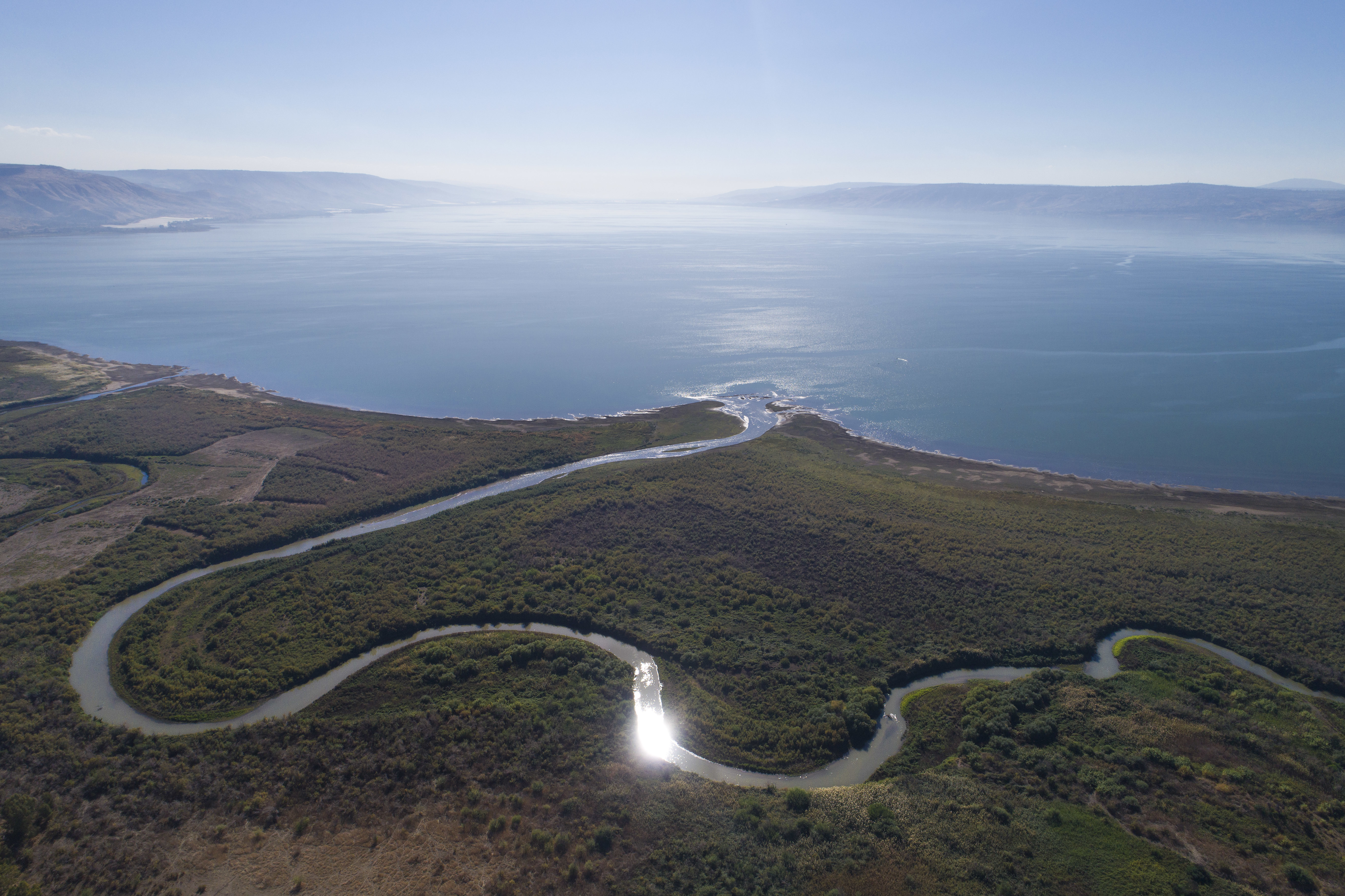 In this Friday, Dec. 8, 2017 photo, an aerial view shows the Jordan River estuary of the Sea of Galilee near the community settlement of Karkom, northern Israel.