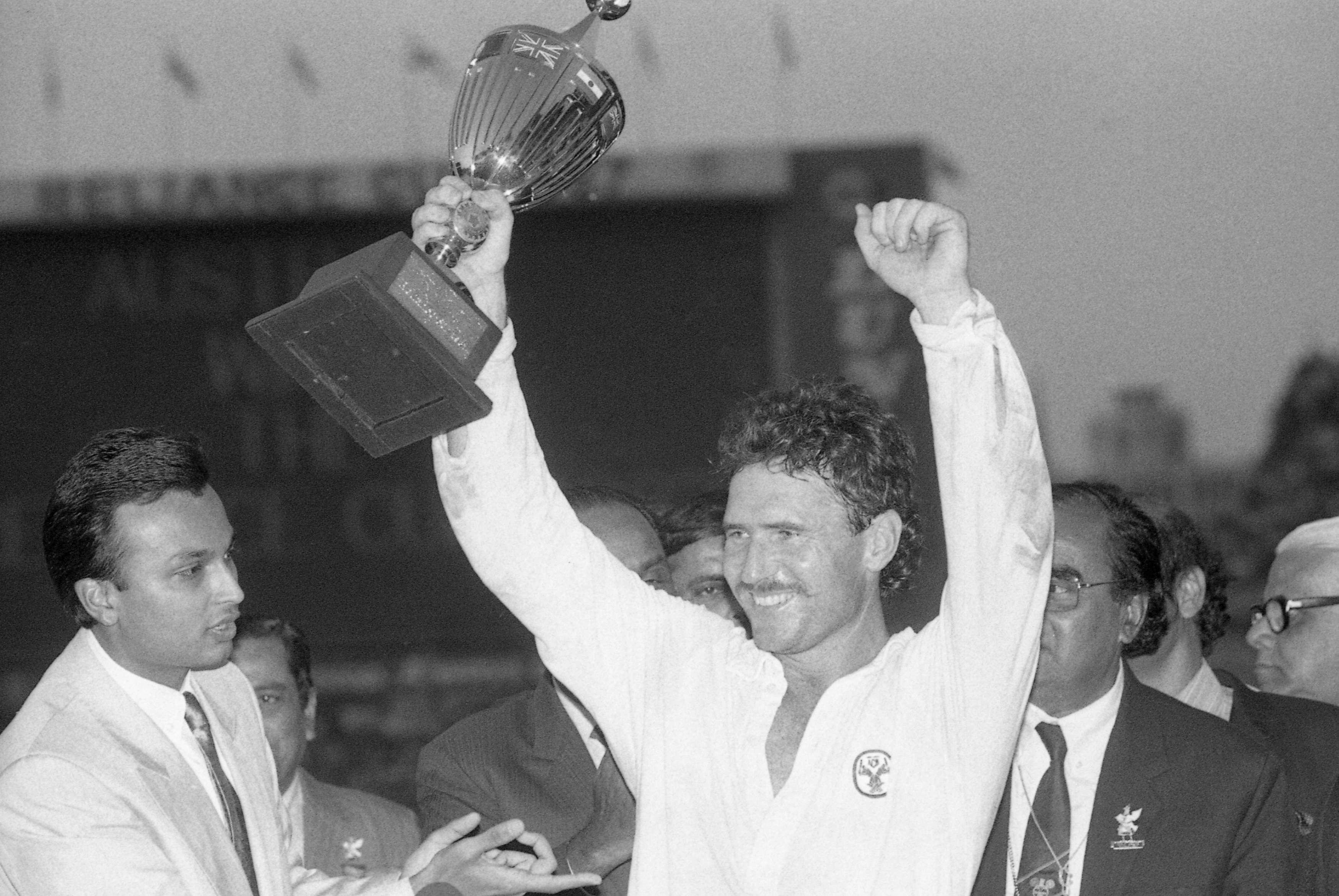 Australian captain Allan Border raises the team's first World Cup trophy