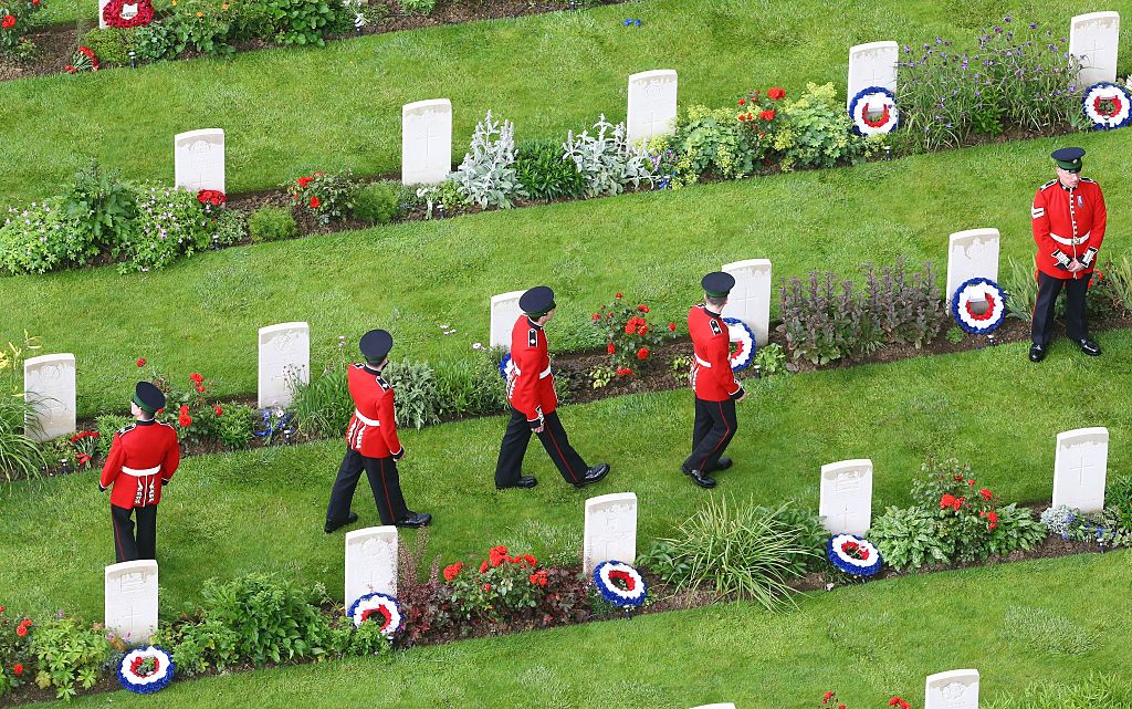 Somme Centenary Commemorations In FranceTHIEPVAL, FRANCE - JULY 1: Members of the Irish Guards look at headstones following a service to mark the 100th anniversary of the start of the battle of the Somme at the Commonwealth War Graves Commission Memorial on July 1, 2016 in Thiepval, France. The event is part of the Commemoration of the Centenary of the Battle of the Somme at the Commonwealth War Graves Commission Thiepval Memorial in Thiepval, France, where 70,000 British and Commonwealth soldiers with no known grave are commemorated. (Photo by Gareth Fuller - Pool/Getty Images)