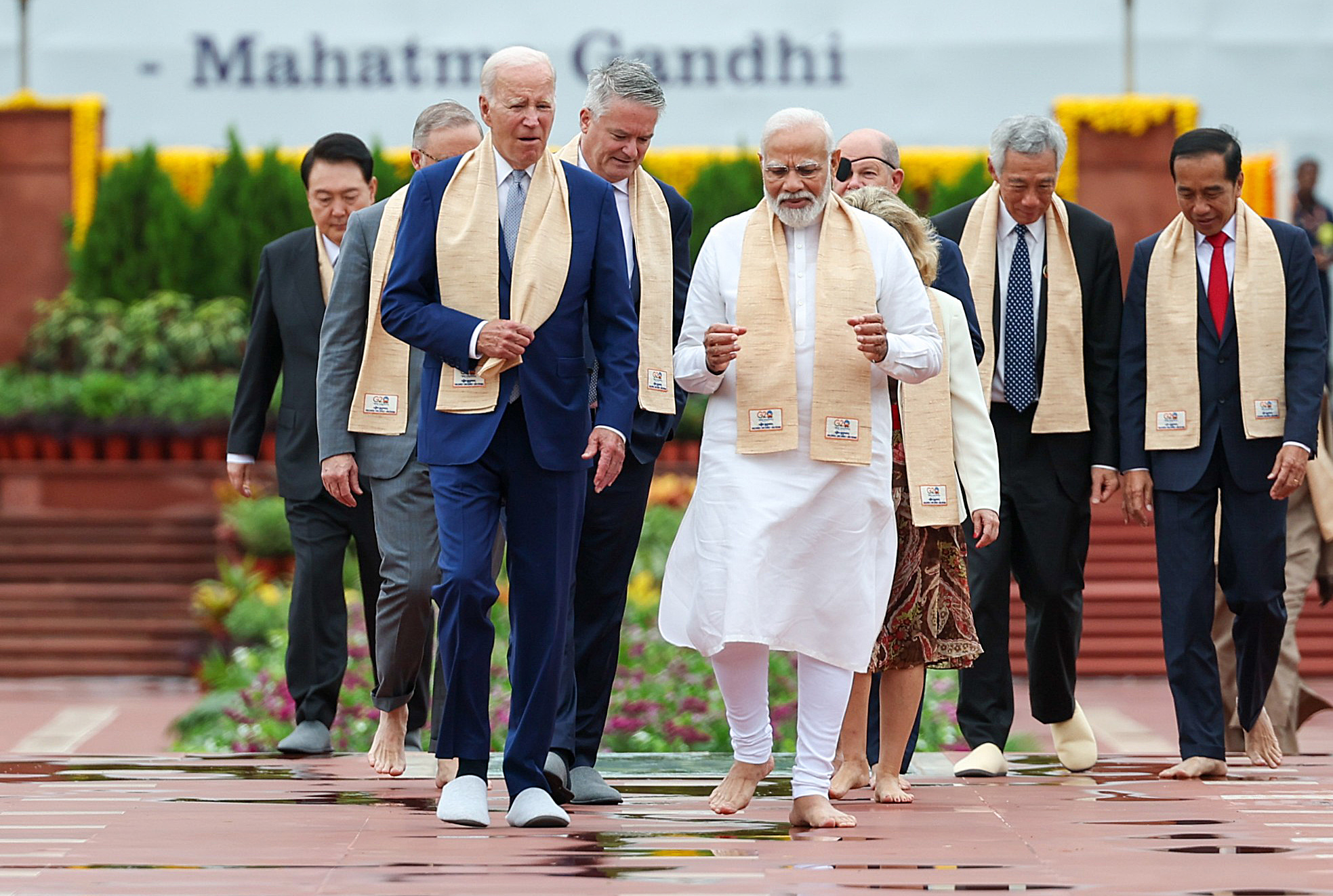 Prime Minister Narendra Modi walks with world leaders at Mahatma Gandhi's memorial in New Delhi