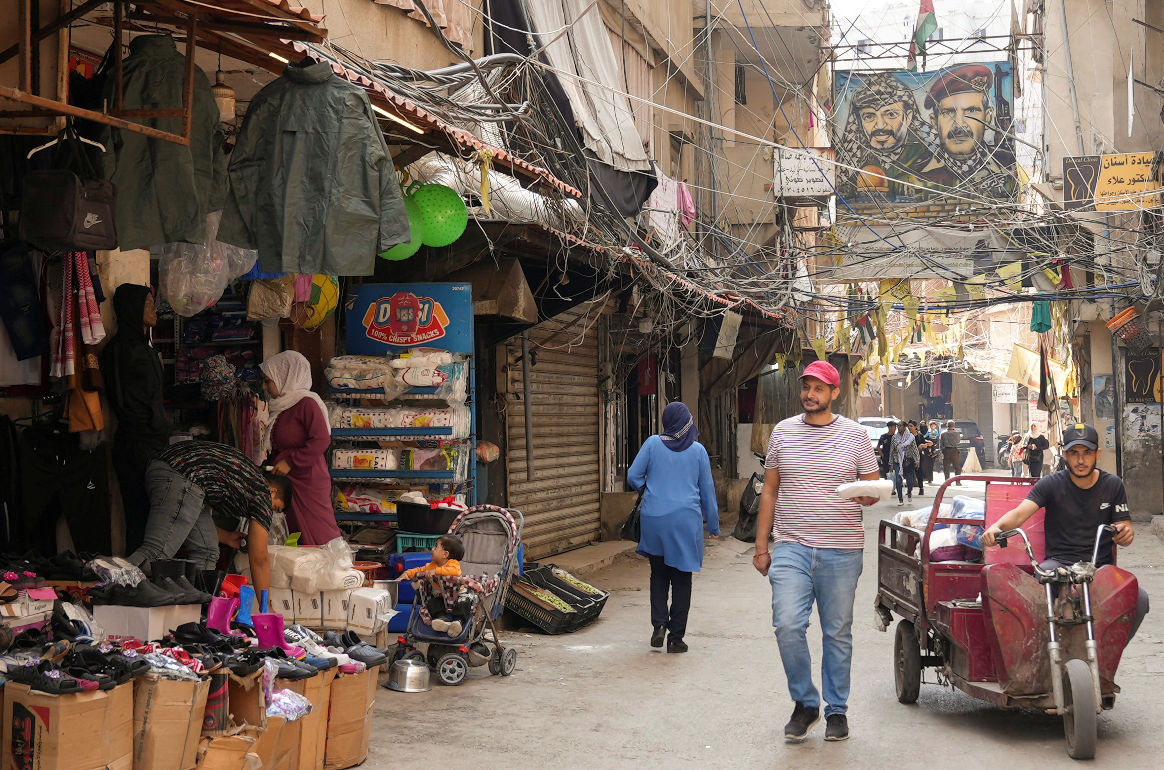 People walk along a street at Burj al-Barajneh Palestinian refugee camp in Beirut, Lebanon November 2, 2022. REUTERS/Issam Abdallah