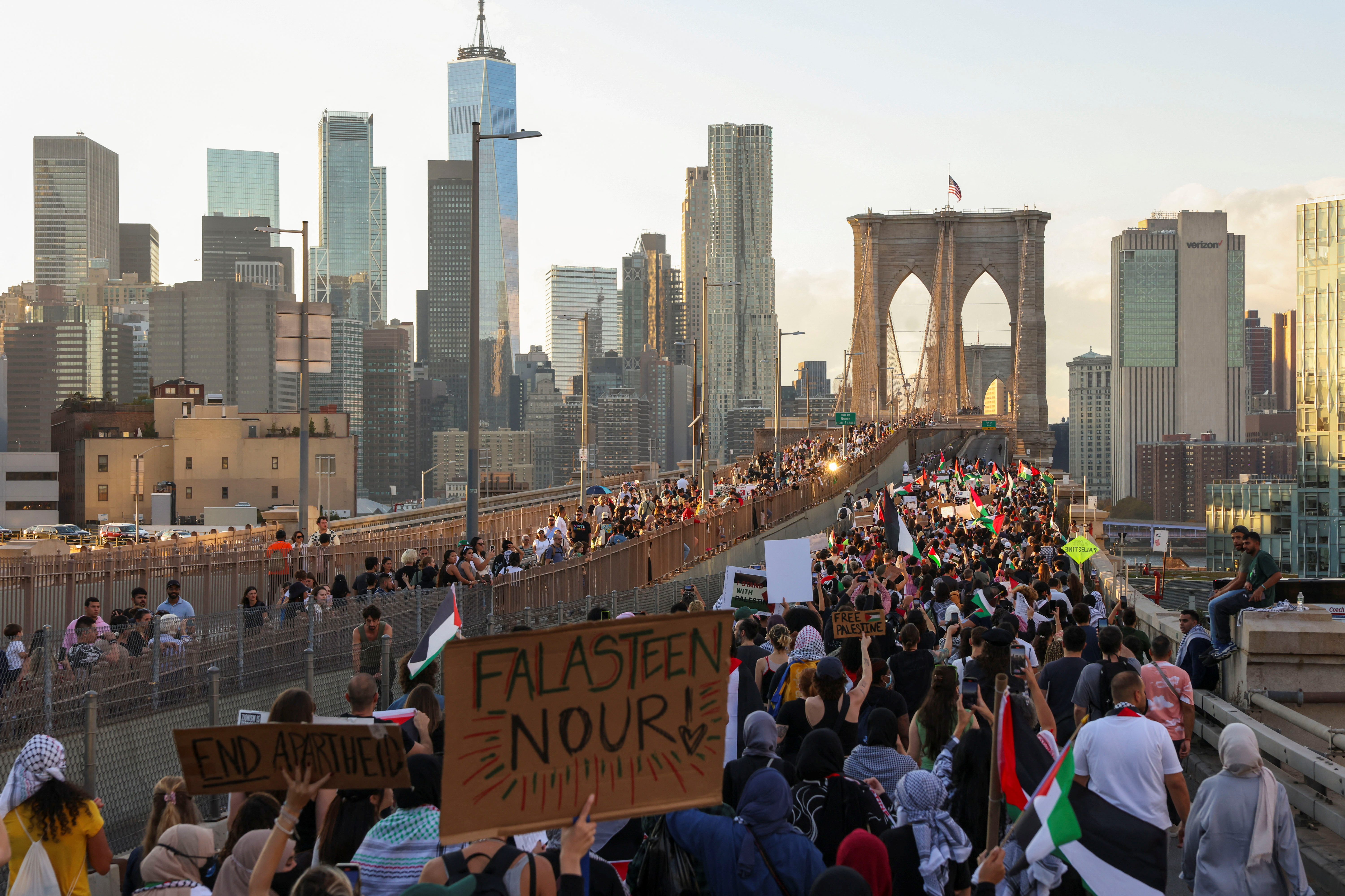 People march over the Brooklyn Bridge as Pro-Palestinian protesters attend "Flood Brooklyn for Gaza" demonstration