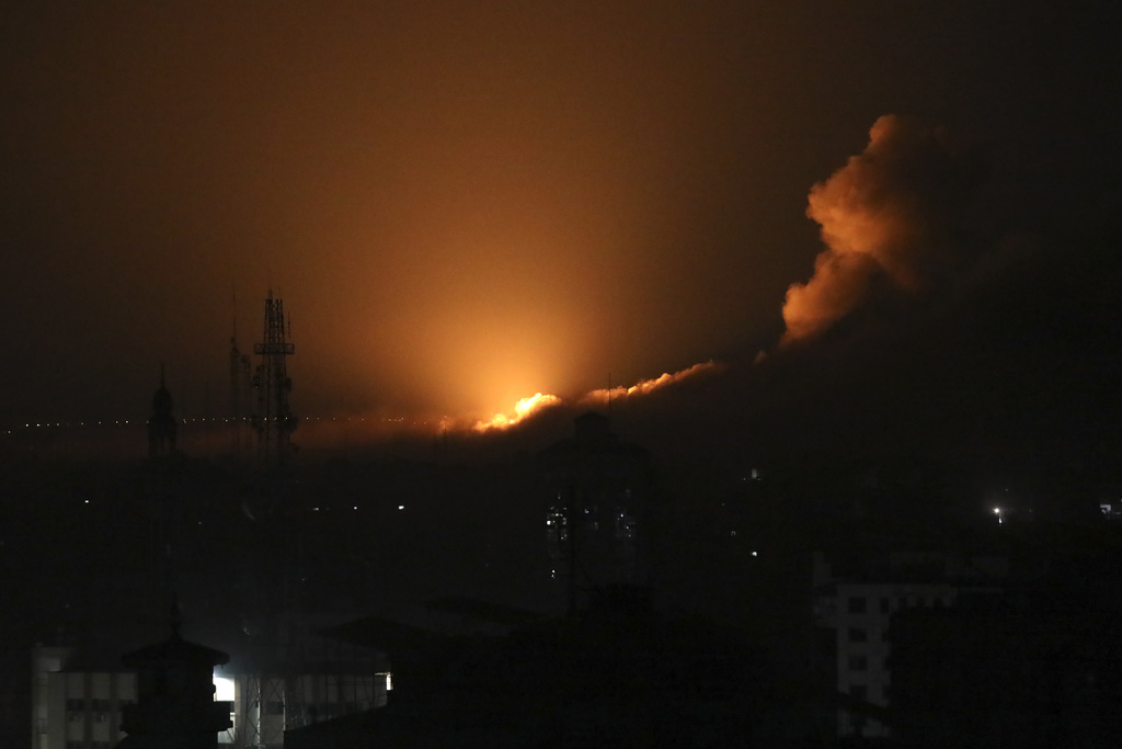 The night sky is lit up by Israeli airstrikes in Gaza