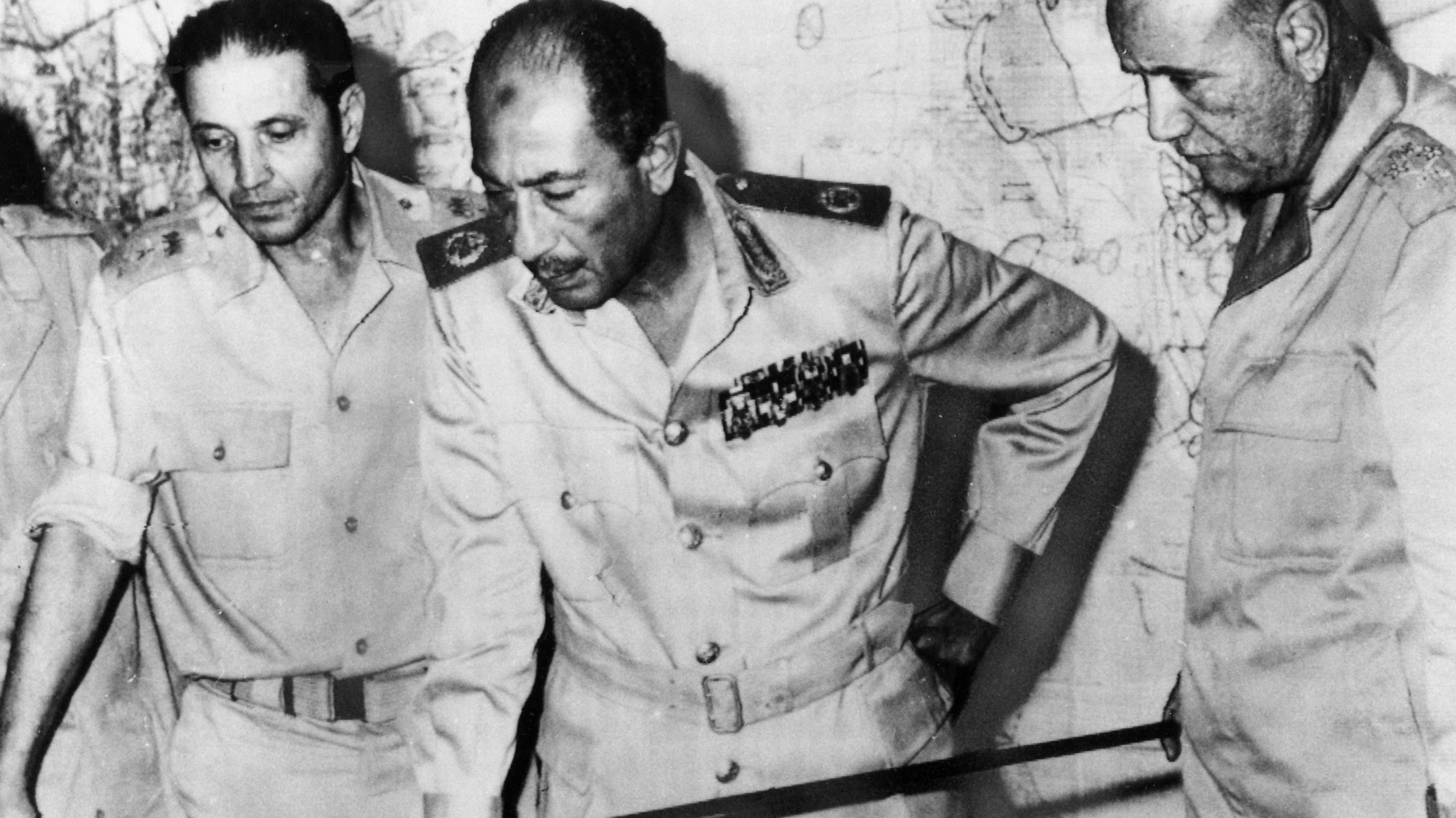 Egypt's chief of staff, Saad el-Shazly (left), President Anwar Sadat (centre) and minister of war' Ismail Ali (right) review battlefield developments