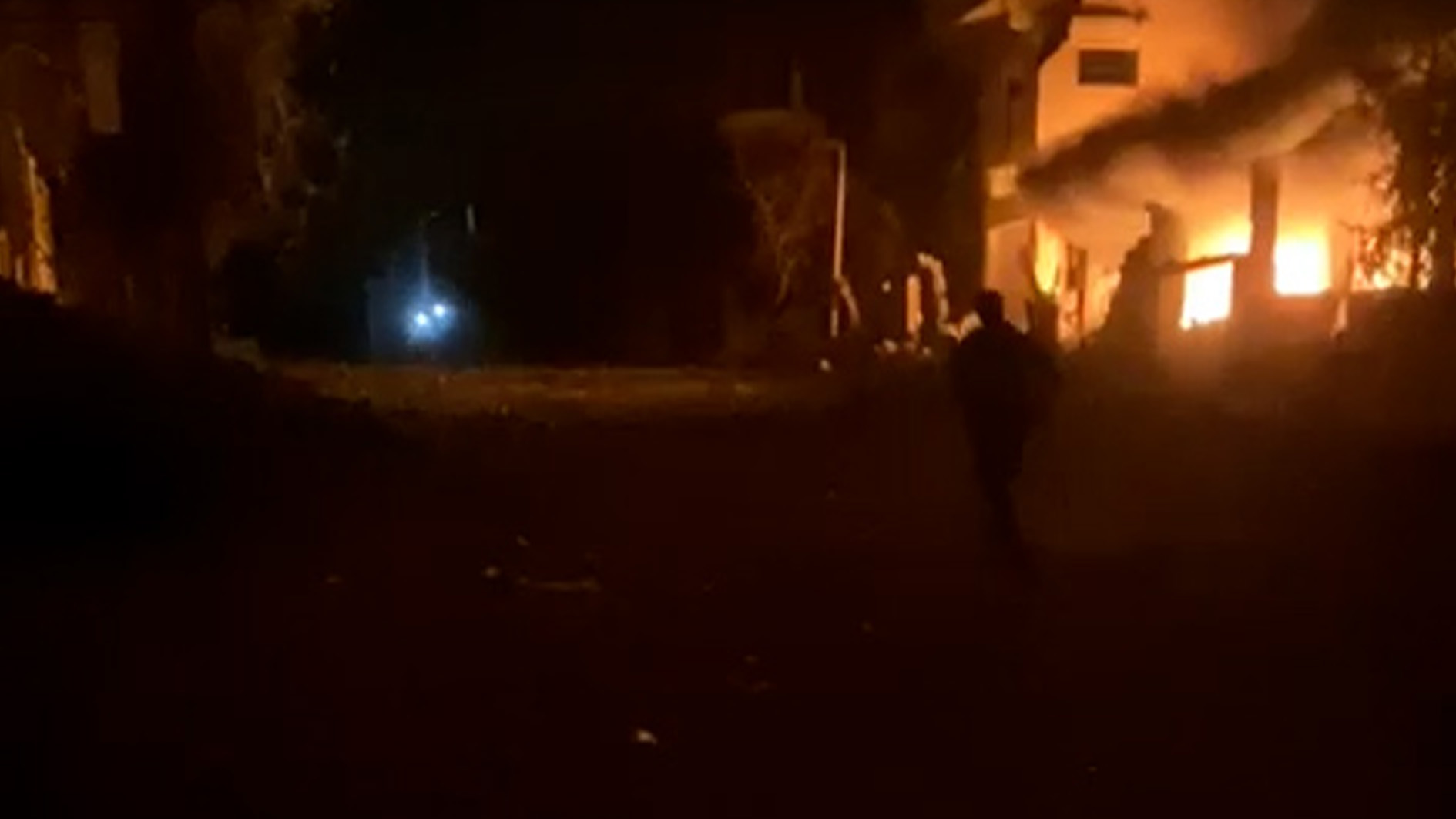 This is the harrowing moment a rescue worker runs for his life in Gaza as Israeli air strikes pounded buildings around him. He helps take a disoriented girl to a nearby hospital.