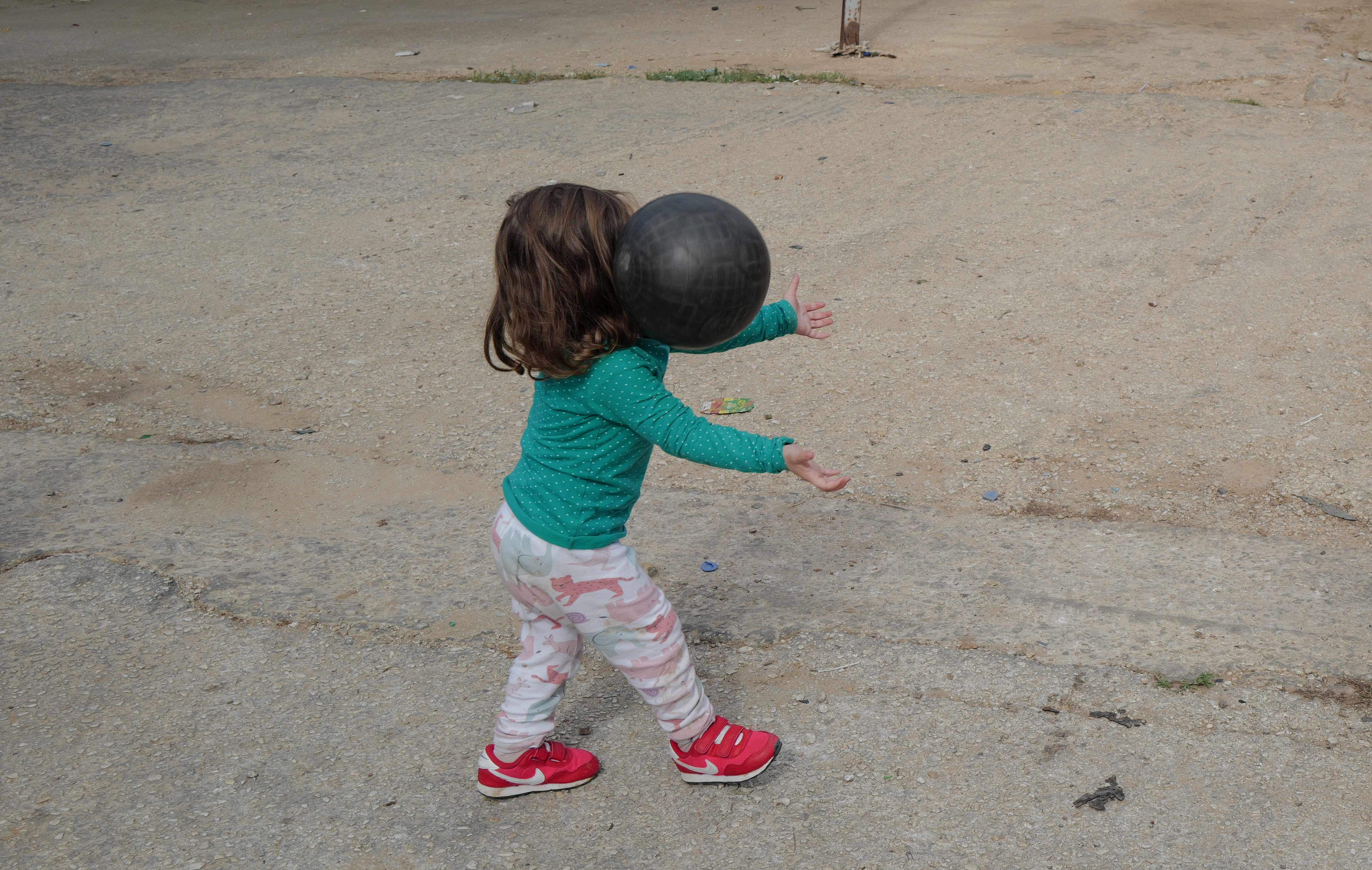 A girl plays at the Christian village of Rmeish, near the Lebanese-Israeli border, amidst tension between Israel and Hezbollah Lebanon.
