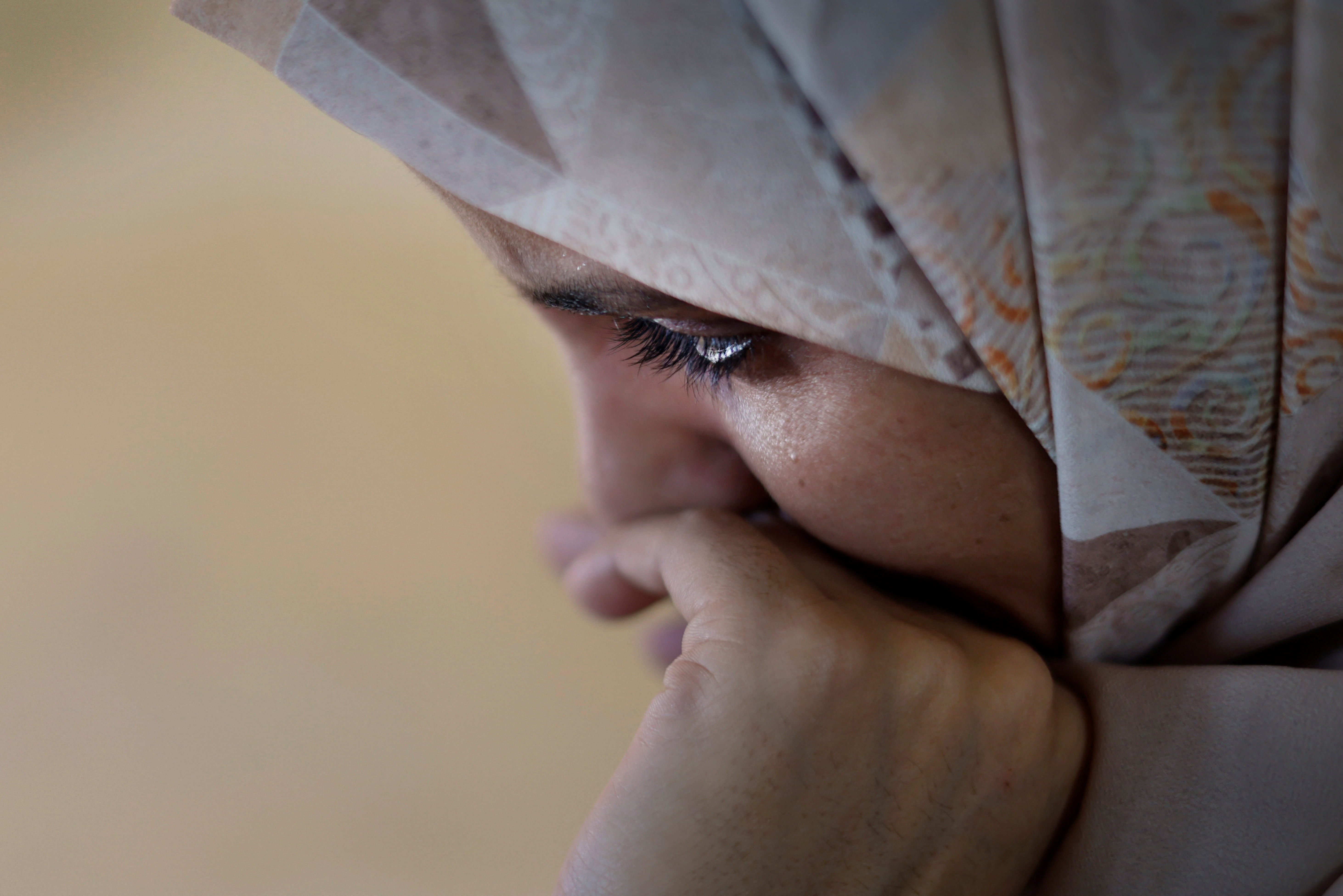 alestinian woman Inas Abu Maamar, 36, whose picture embracing the body of her 5-year-old niece Saly who was killed in an Israeli air strike went viral on local and international media, reacts in Khan Younis in the southern Gaza Strip.