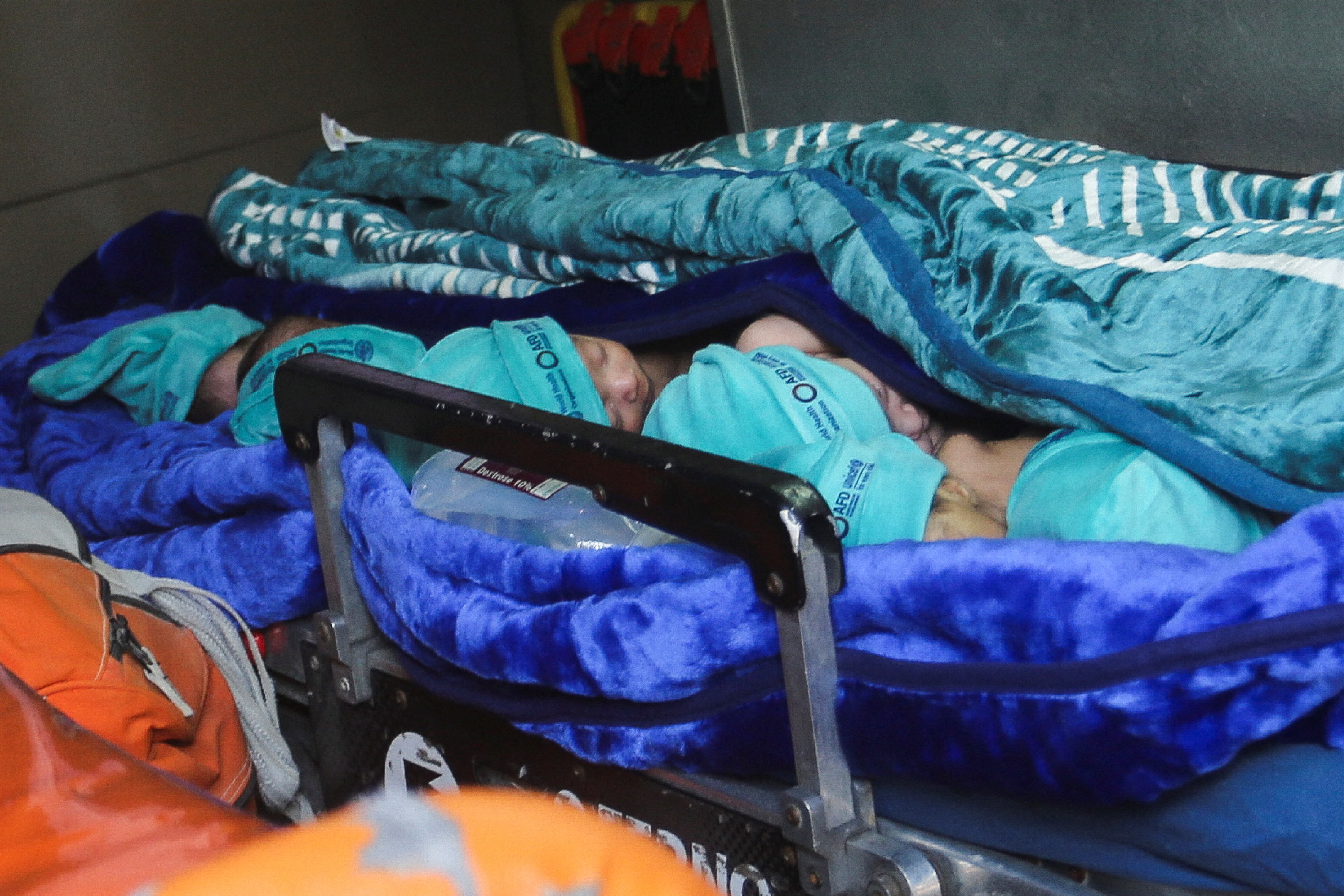 Premature babies, who were evacuated from Al Shifa hospital, lie in an ambulance before they are transported for treatment in UAE, at Rafah border crossing with Egypt, in Rafah