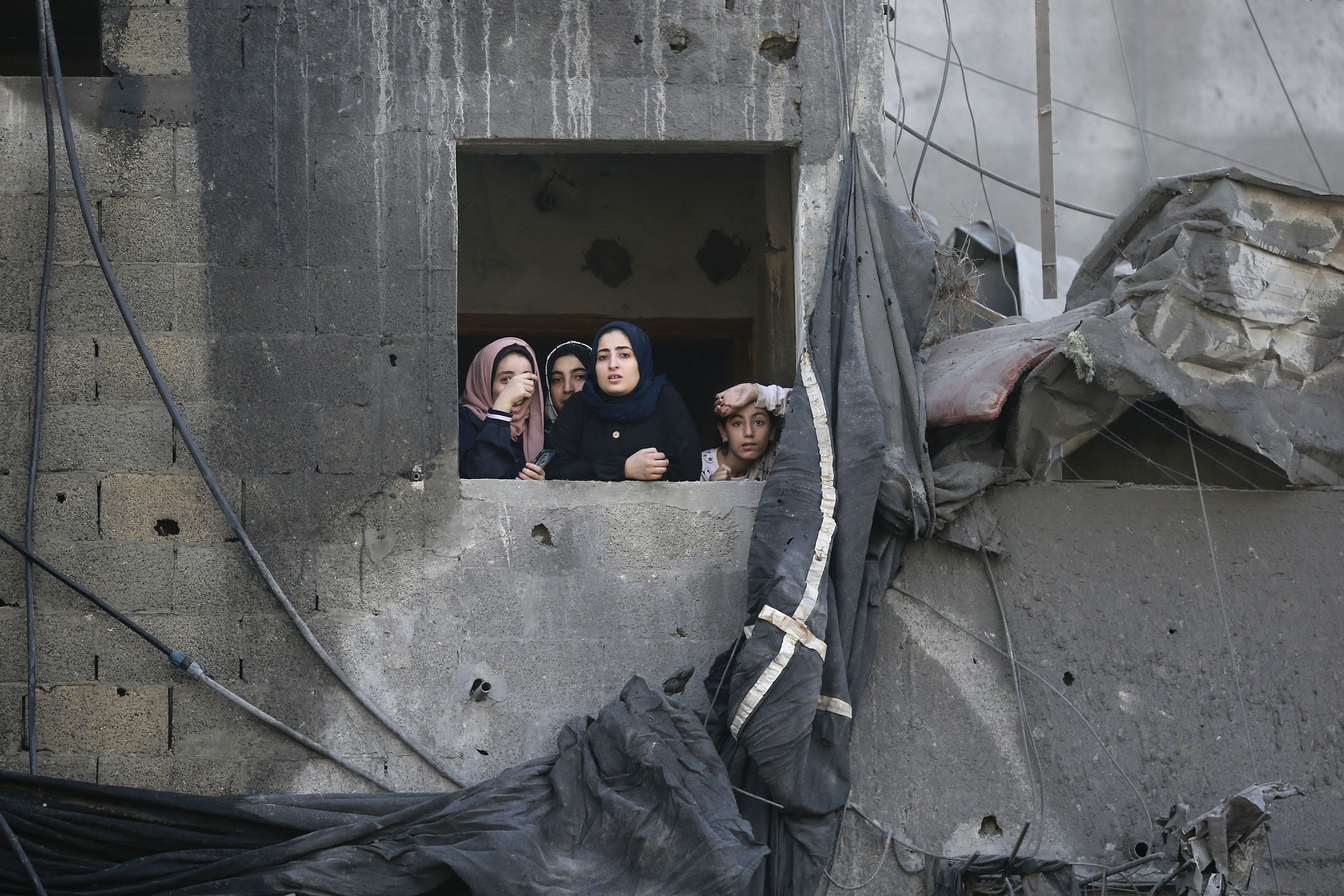 Palestinians gesture as they check the destruction n the aftermath of an Israeli strike the previous night in the Jabalia camp for Palestinian refugees in the Gaza Strip.