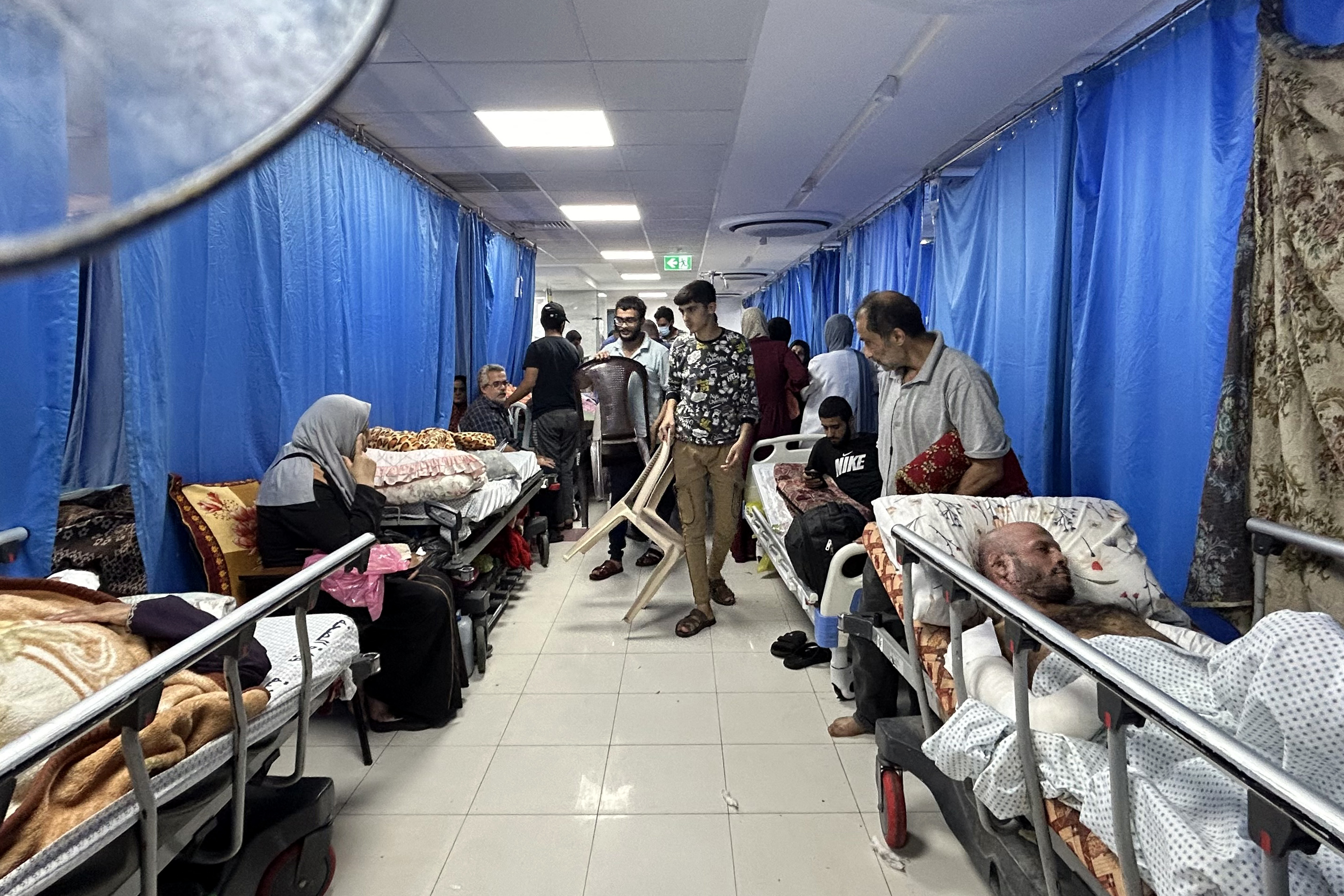 Patients and internally displaced people are pictured at Al-Shifa hospital in Gaza City
