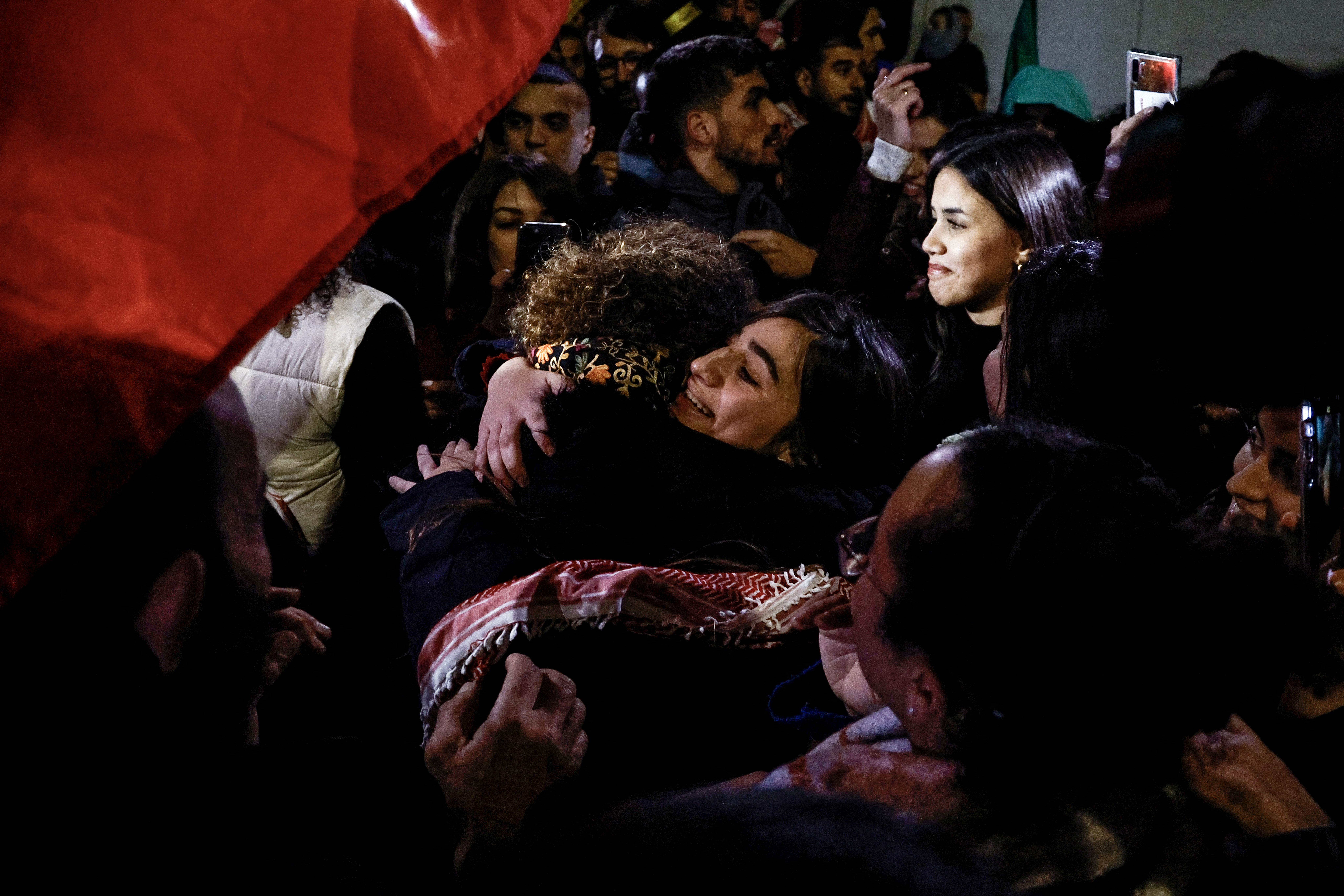 Newly released Palestinian prisoner Rouba Assi hugs relatives during a welcome ceremony for prisoners freed from Israeli jails in exchange for Israeli hostages released by Hamas from the Gaza Strip, during a welcome ceremony in Ramallah in the occupied West Bank.