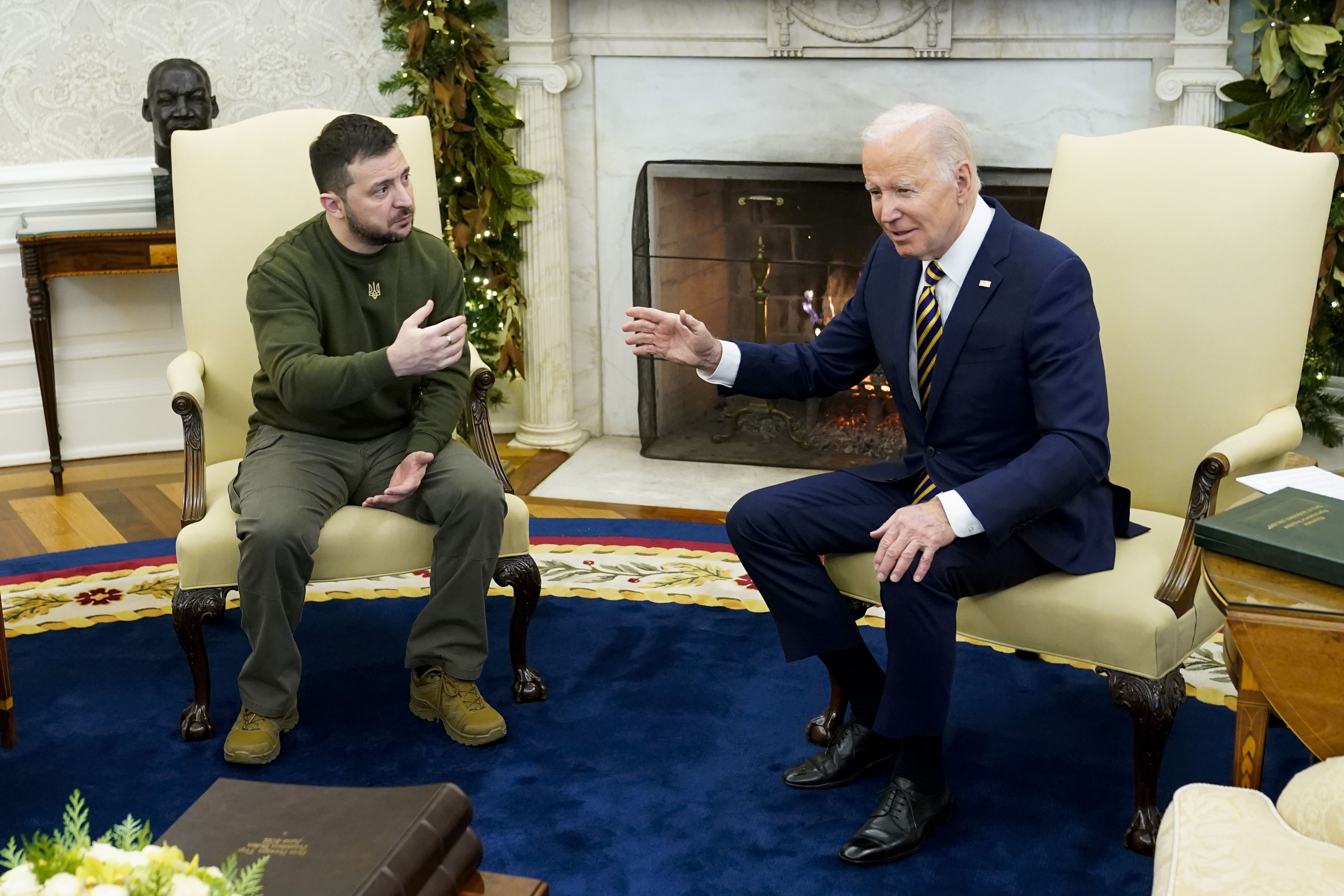 President Joe Biden, right, poses for a photo with his Ukrainian counterpart Volodymyr Zelenskyy in the Oval Office in December 2022