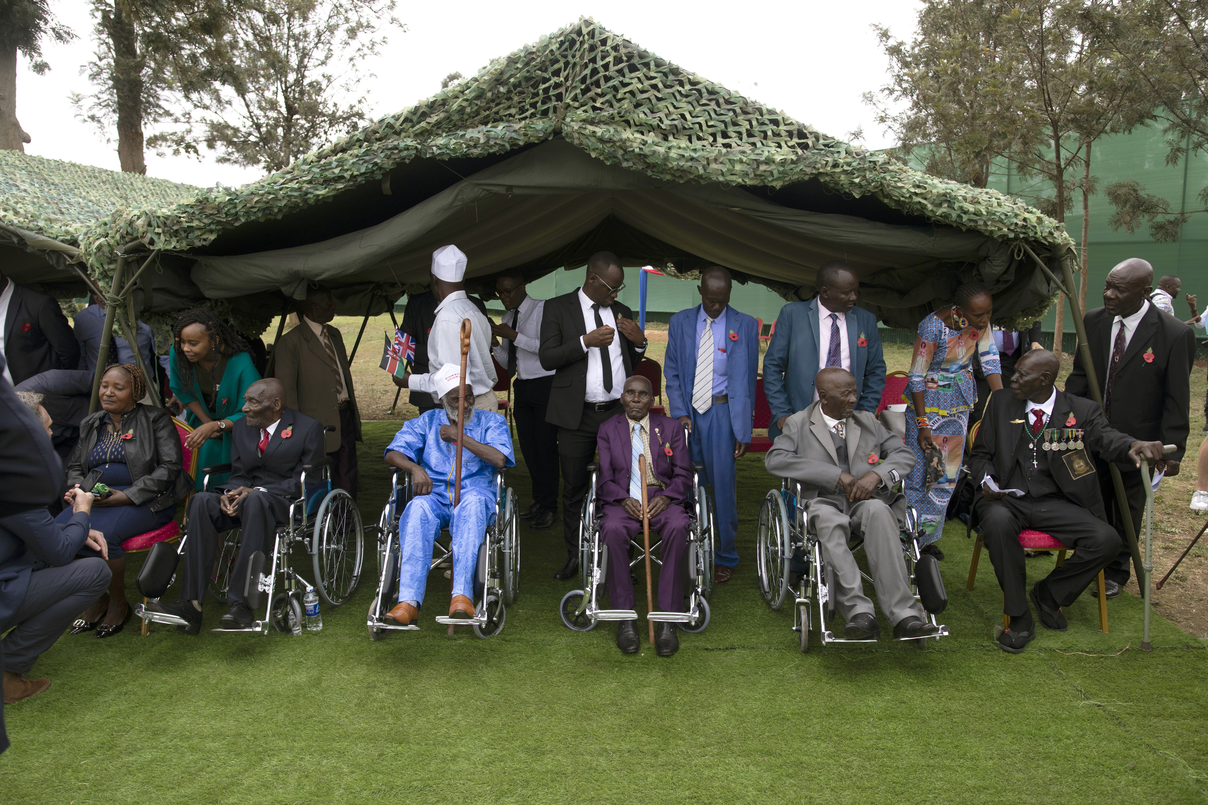 Kenyan World War II veterans and family members wait to meet King Charles III at the Kariokor World War II Commonwealth Cemetery in Nairobi, Kenya, on November 1, 2023