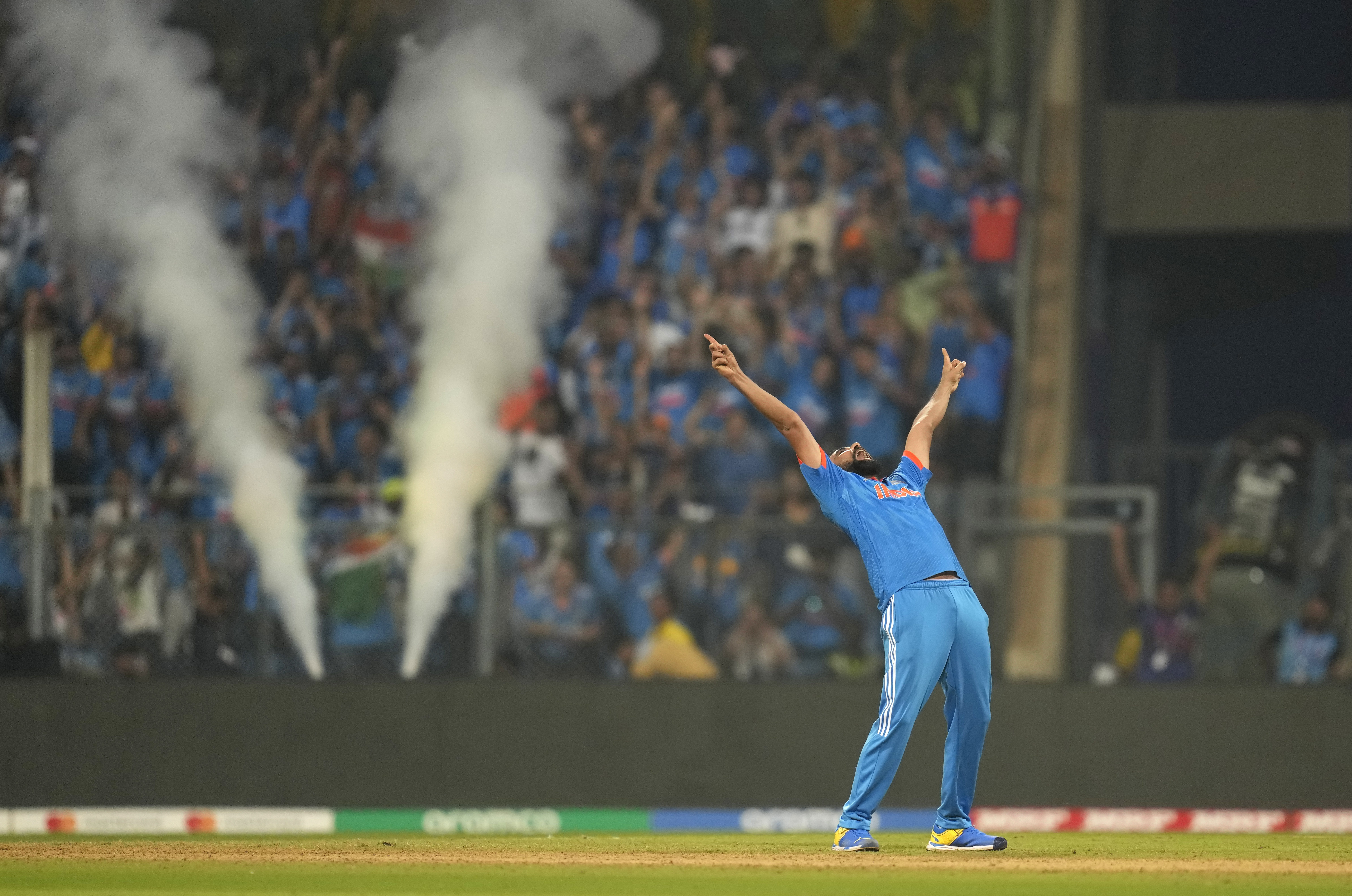 India's Mohammed Shami celebrates the wicket of New Zealand's Daryl Mitchell and also five wicket haul during the ICC Men's Cricket World Cup first semifinal match between India and New Zealand in Mumbai, India, Wednesday, Nov. 15, 2023. (AP Photo/Rafiq Maqbool)