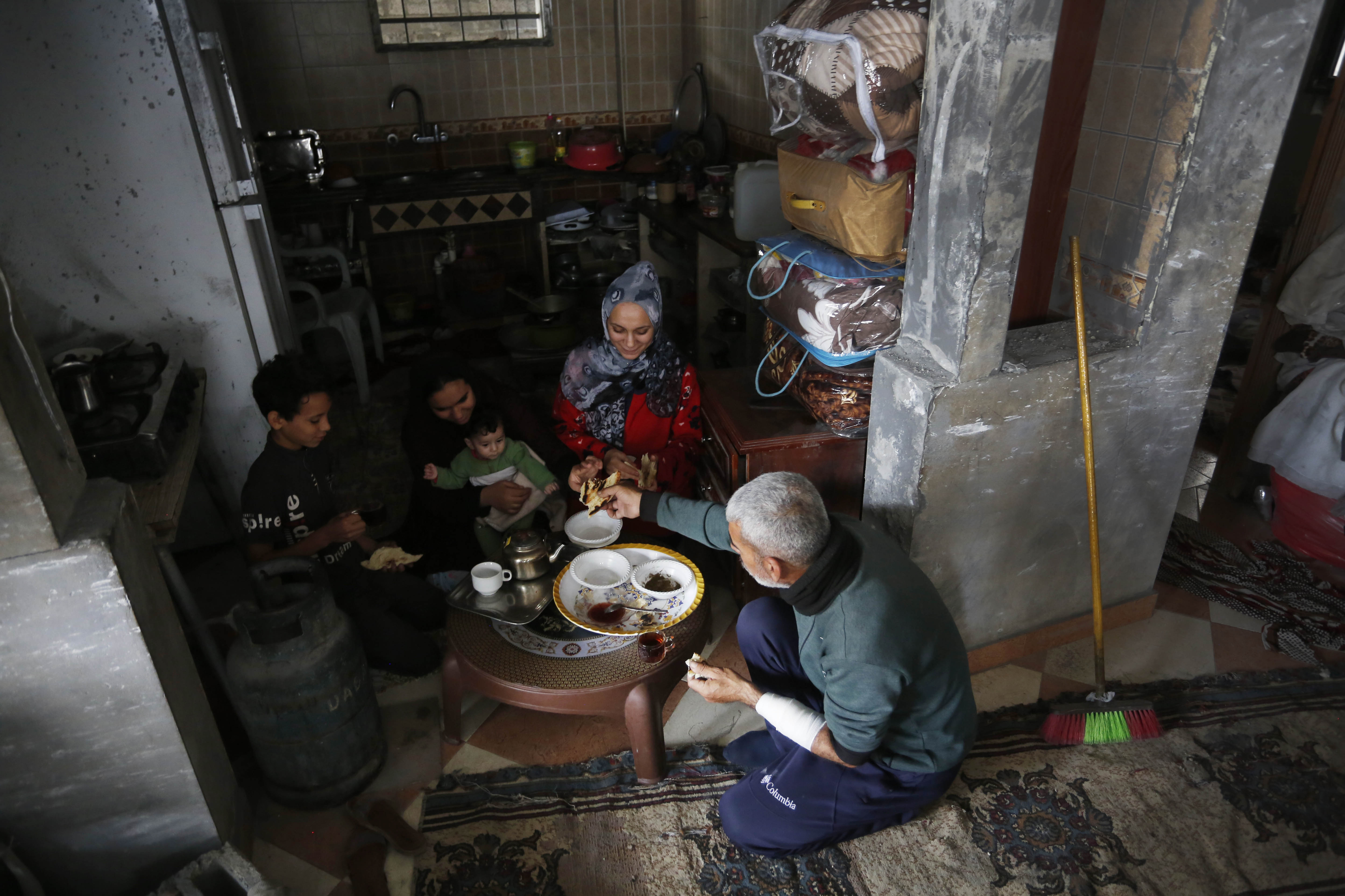The Naji family sit in their kitchen for breakfast