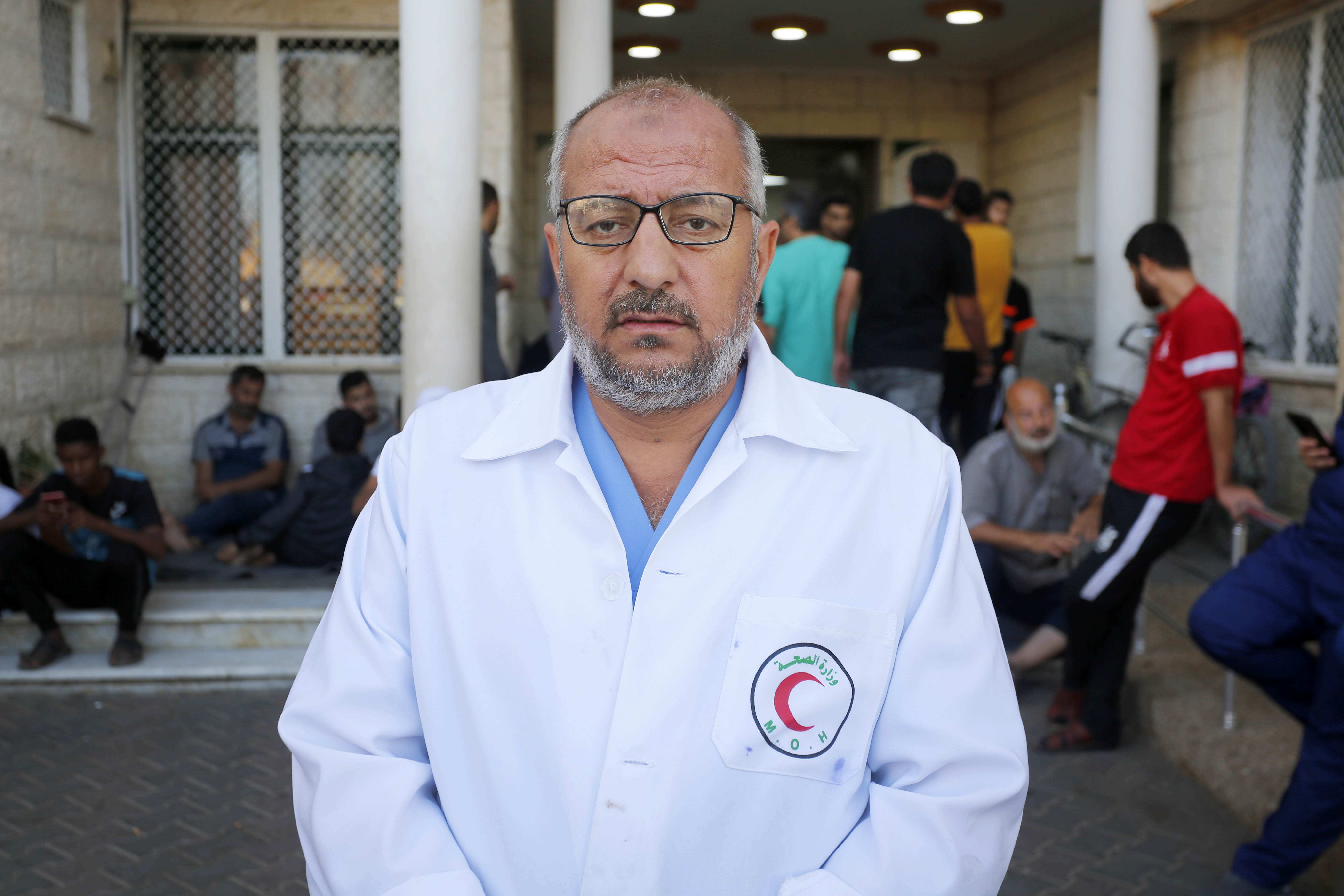 Palestinians using the sea to wash their clothes and bathe