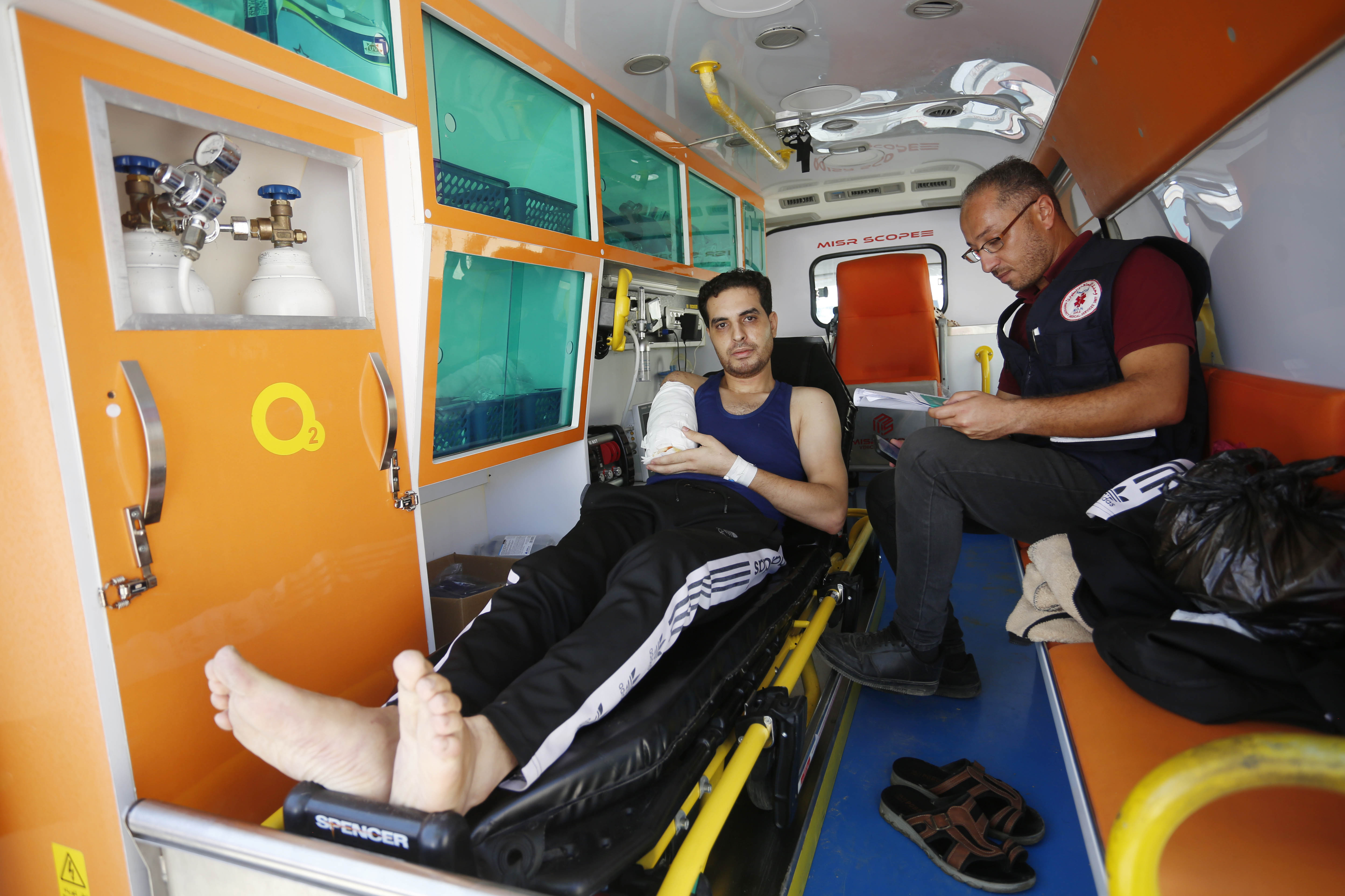 Khader Shamout, a paramedic volunteer, was wounded in an Israeli air attack while transporting other wounded Palestinians in am ambulance in the southern city of Khan Younis