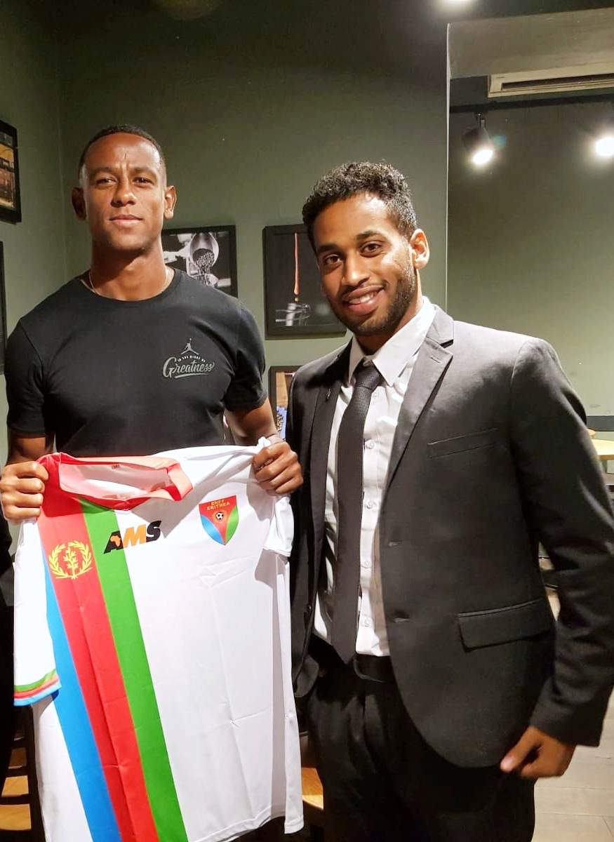 Tedros 'Golgol' Mebrahtu (left), with then Eritrean football federation official Daniel Solomon in 2018