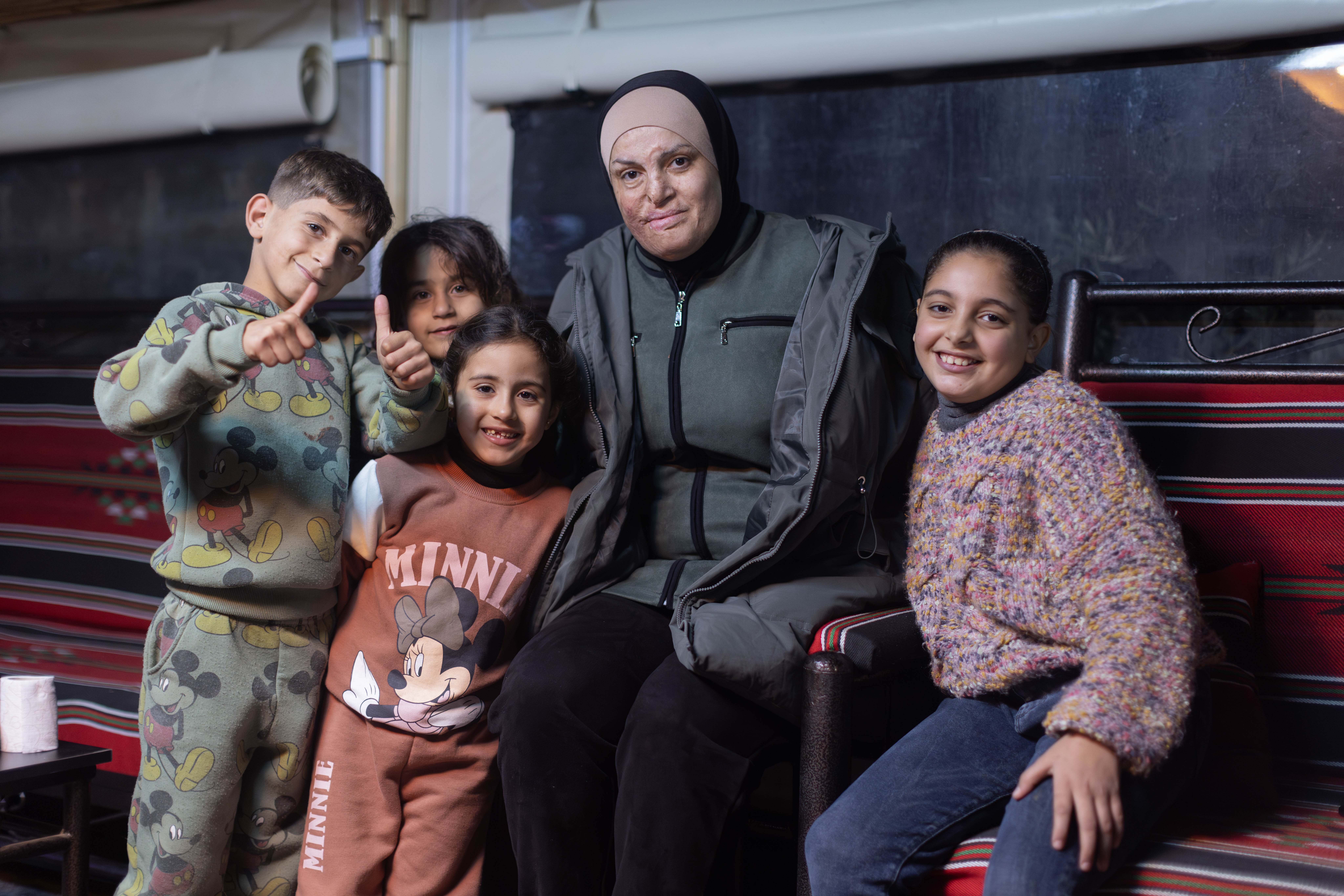 Israee sitting with children