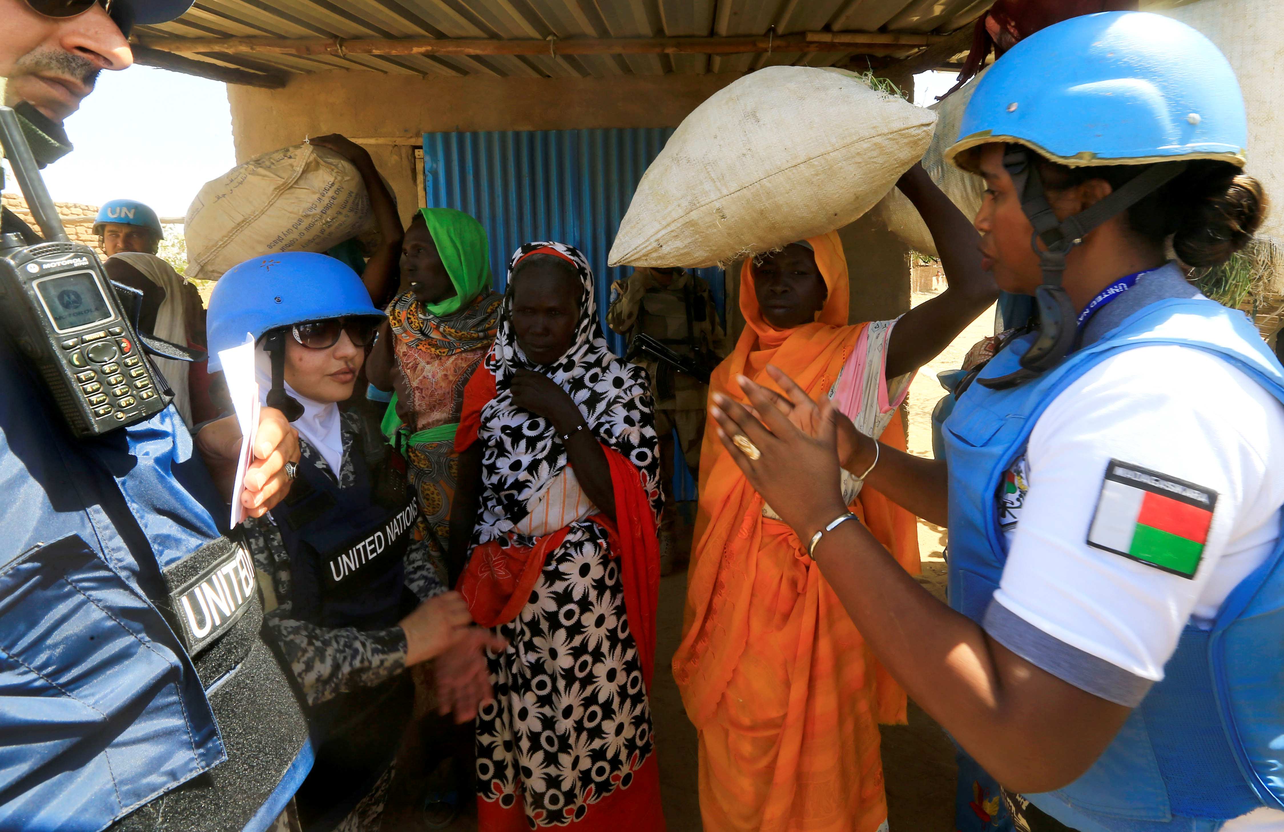 United Nations staff talk to internally displaced Sudanese women in Darfur