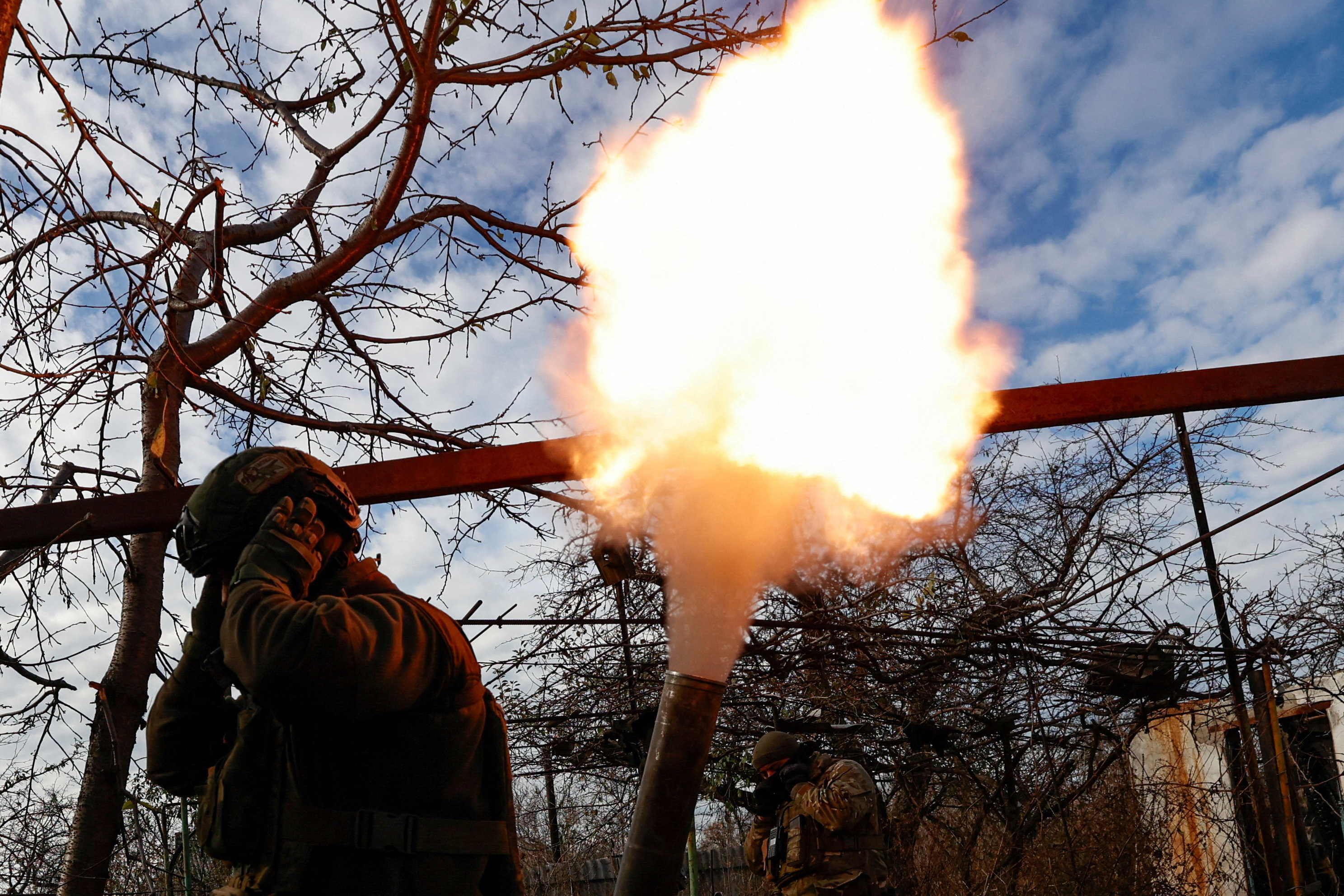 Members of Ukraine's National Guard Omega Special Purpose unit fire a mortar toward Russian troops in the front line town of Avdiivka, amid Russia's attack on Ukraine, in Donetsk region, Ukraine November 8, 2023. Radio Free Europe/Radio Liberty/Serhii Nuzhnenko via REUTERS