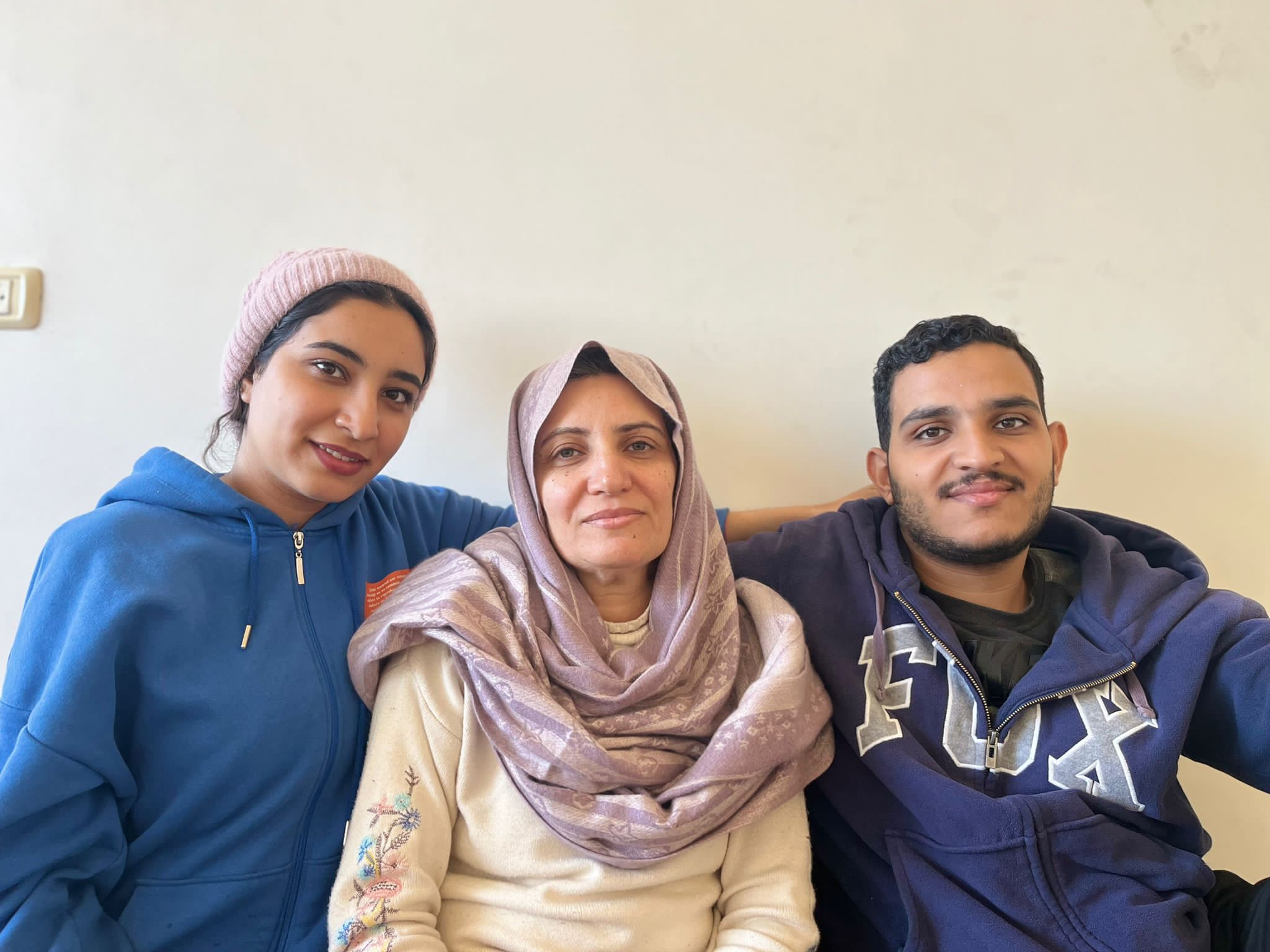 Rania Sakallah (centre), with 22-year-old twins Rana (left) and Mohammed (right)