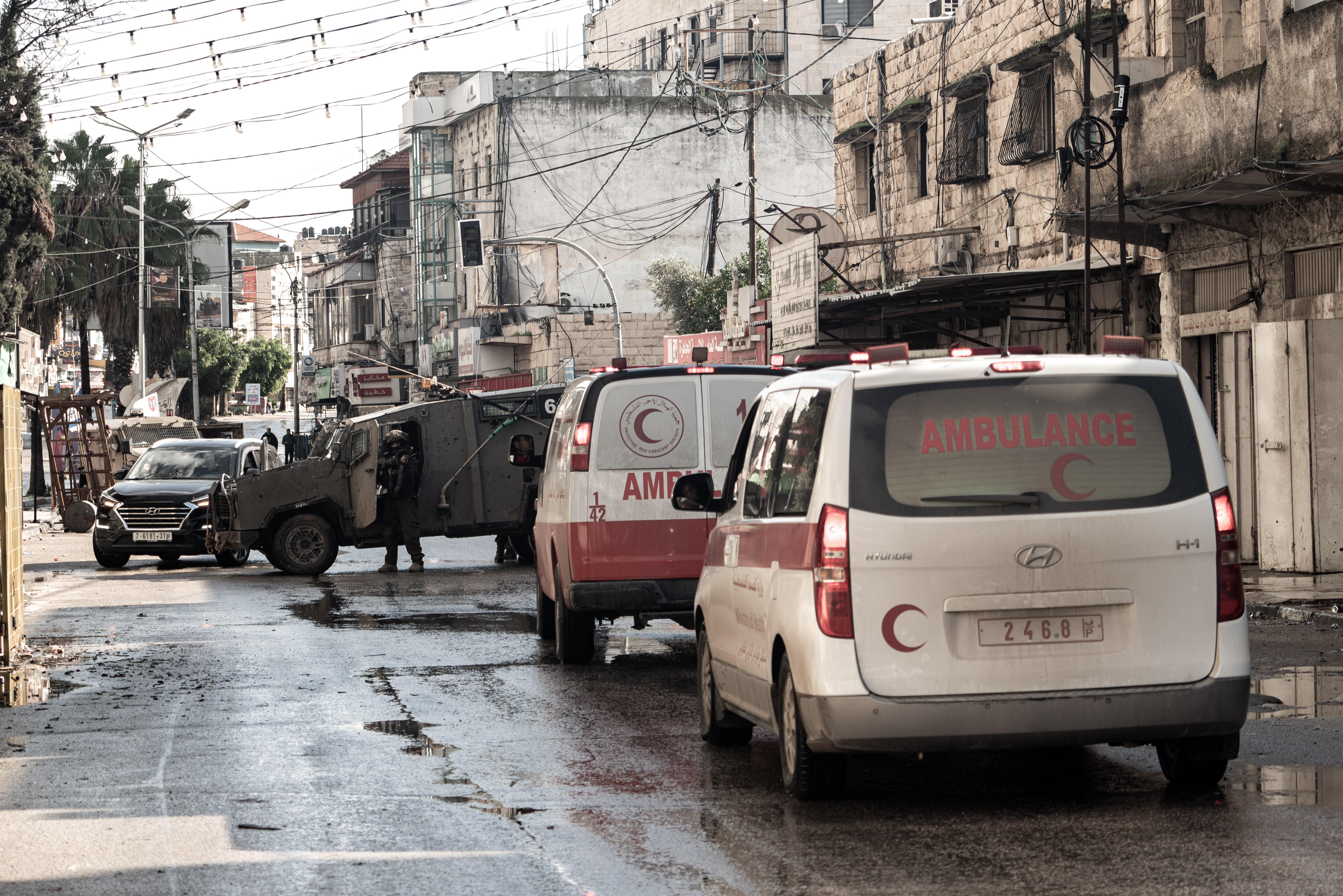 Medical teams arrive at the site where Israeli forces bombed three houses, killed eight Palestinians, and injured others during a raid in Jenin, which started on Tuesday. [Vincenzo Circosta/Anadolu]