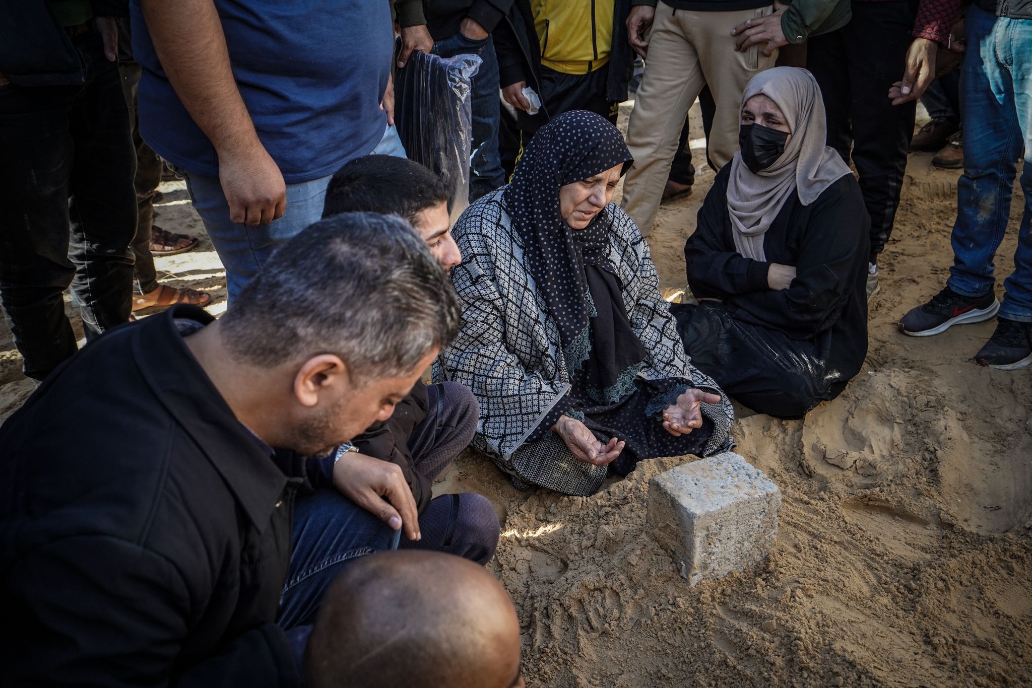 People attend the funeral ceremony of Al Jazeera cameraman Samir Abu Dhaka, who died in the Israeli attacks in Khan Yunis, Gaza on December 16