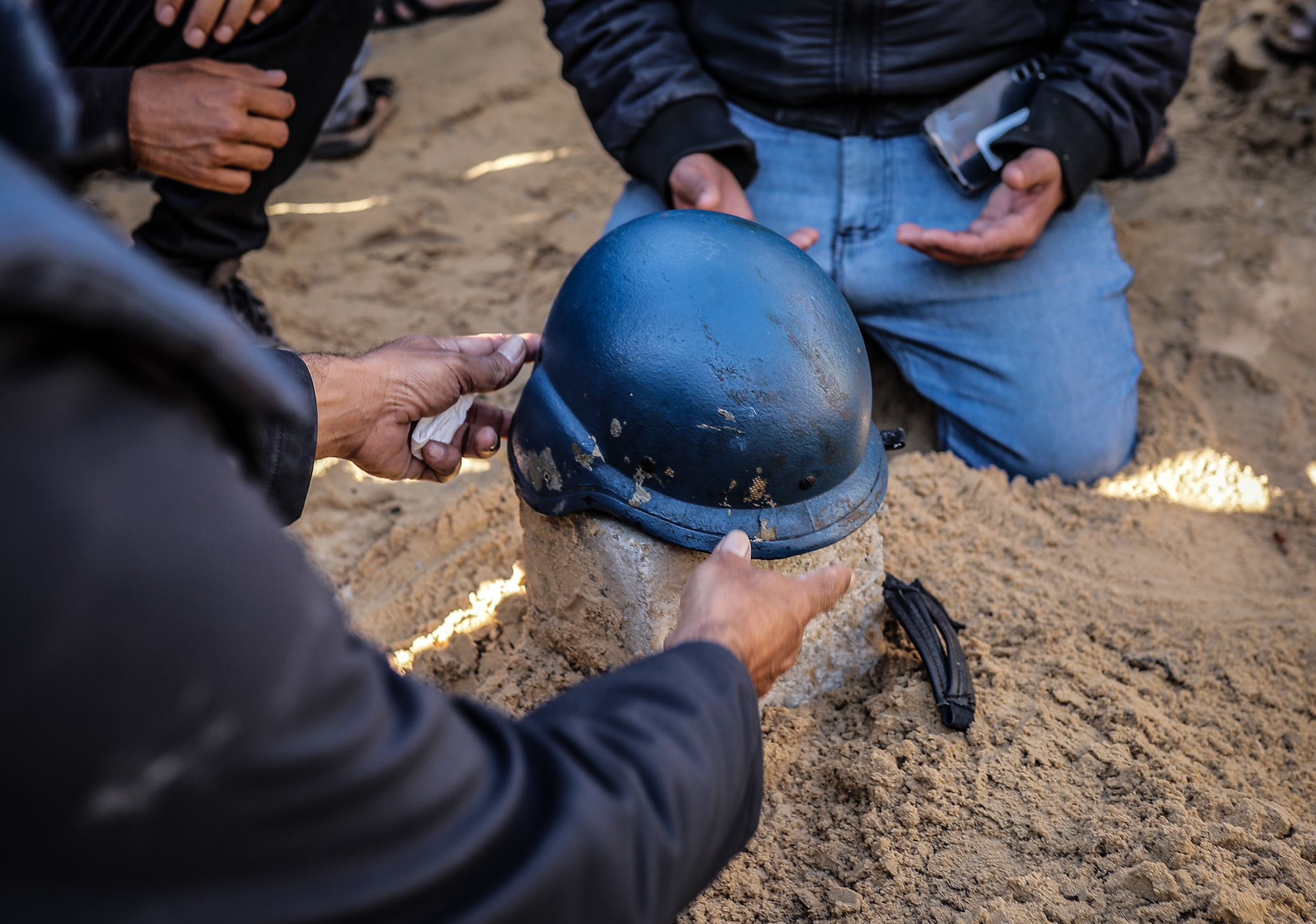 People attend the funeral ceremony of Al Jazeera cameraman Samir Abu Dhaka, who died in the Israeli attacks in Khan Yunis, Gaza on December 16, 2023. Samir Abu Dhaka was wounded during the attacks and was prevented from receiving first aid by Israeli forces