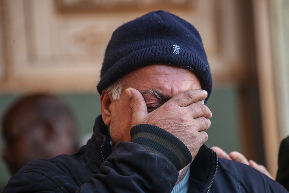 People mourn as they collect the bodies of Palestinians killed in an airstrike on December 02, 2023 in Khan Yunis, Gaza.