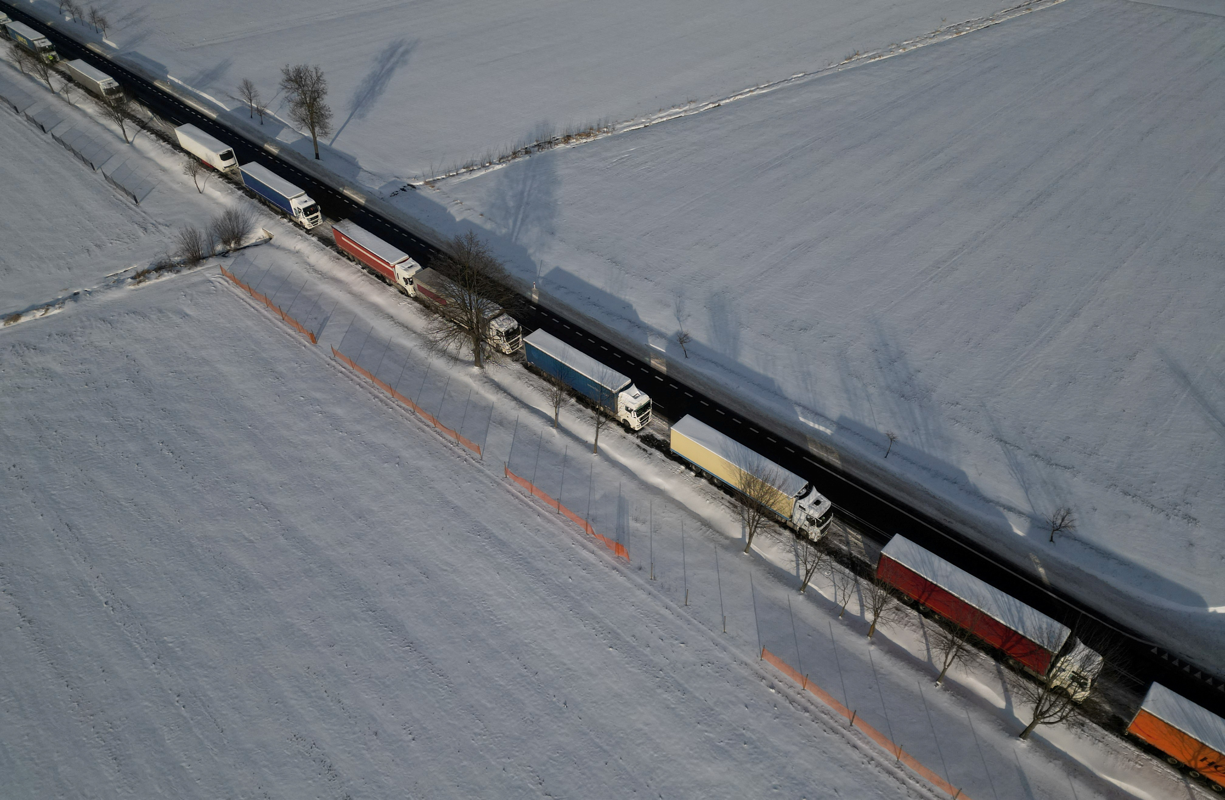 Trucks line up in a long queue to cross the Polish-Ukrainian border
