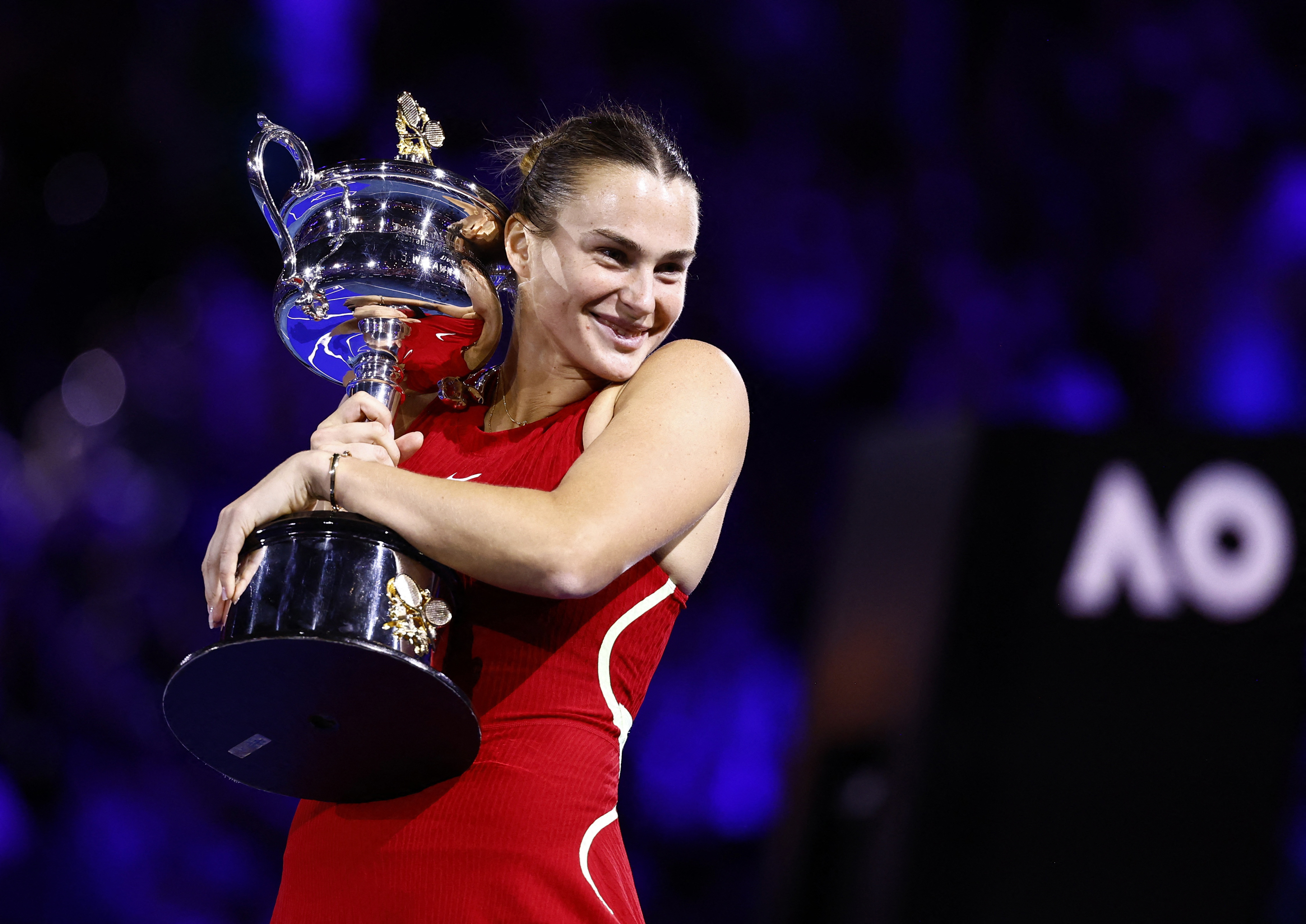 Sabalenka hugs the trophy
