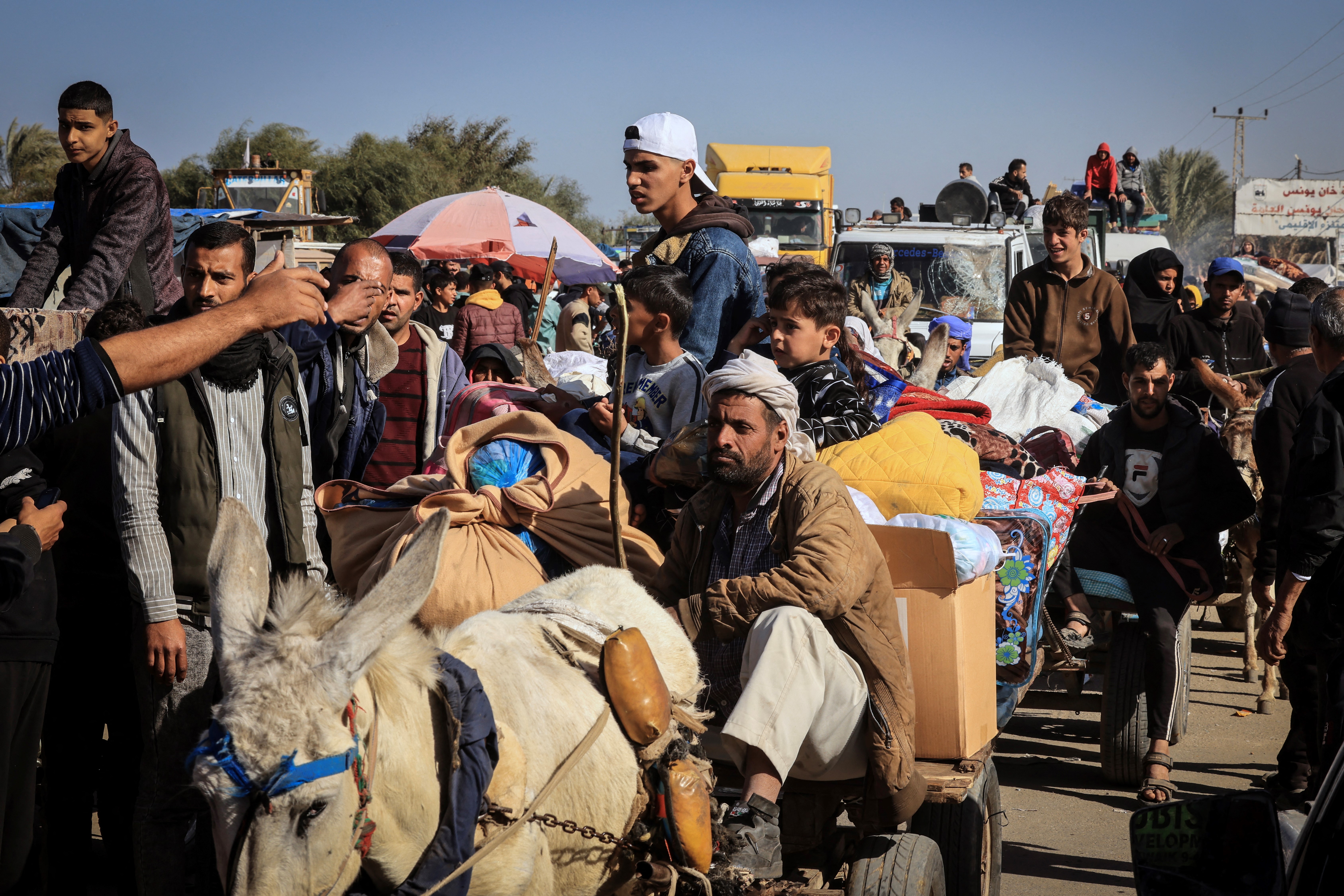 Palestinian families fleeing the city on the coastal road leading to Rafah