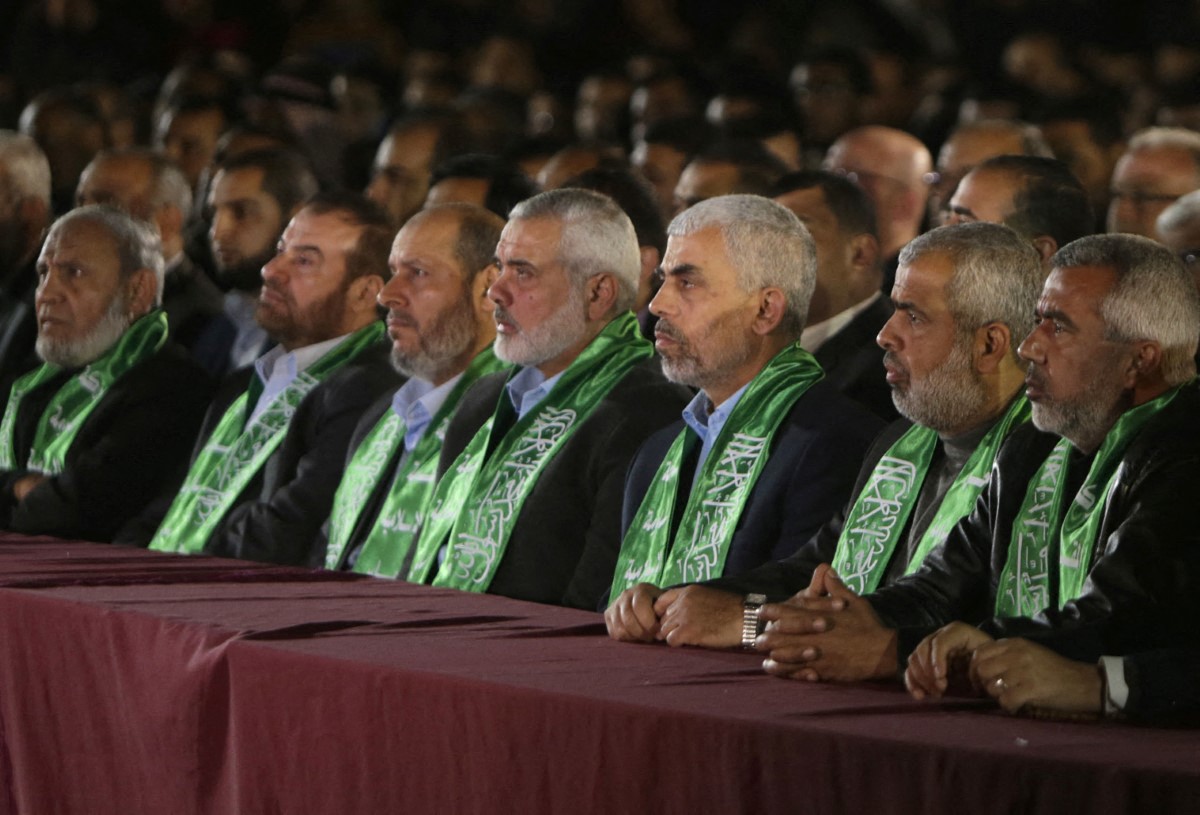 Yahya Sinwar (3rd R), the new leader of the Hamas Islamist movement in the Gaza Strip and senior political leader Ismail Haniyeh (4th R) sit among other Hamas officials during a memorial for Mazen Faqha, a leader of the Islamist movement who was shot dead by unknown gunmen in the Gaza Strip, on March 27, 2017 in Gaza City. Hamas officials have said the killing bears the hallmarks of Israel's intelligence service Mossad, but Israel has not commented on the shooting.
