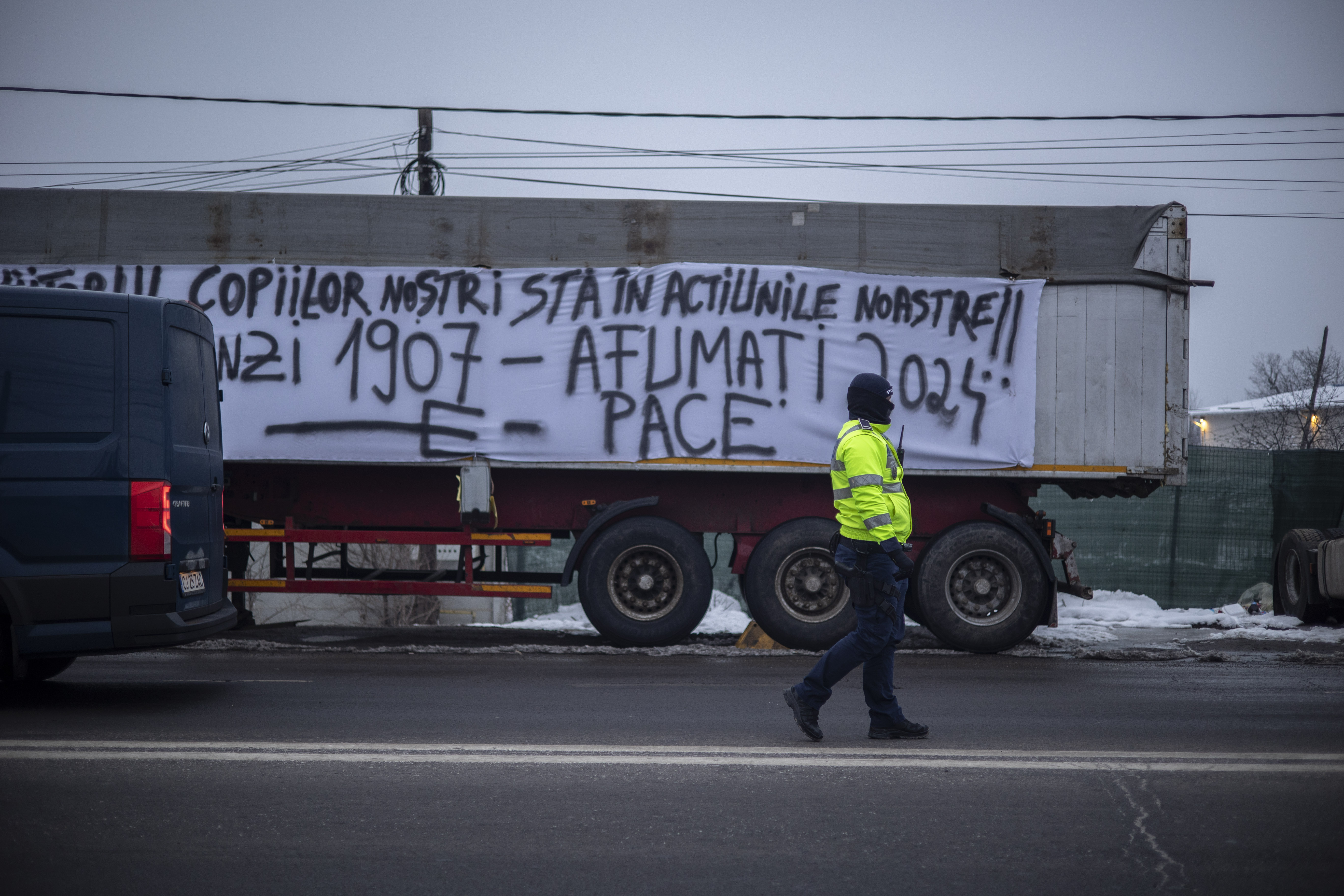 "The future of our children lies in our actions!! Flămânzi 1907 – Afumați 2024," reads a large white banner on a truck in Afumati, referencing a historic peasant revolt that took place in Romania a century ago.