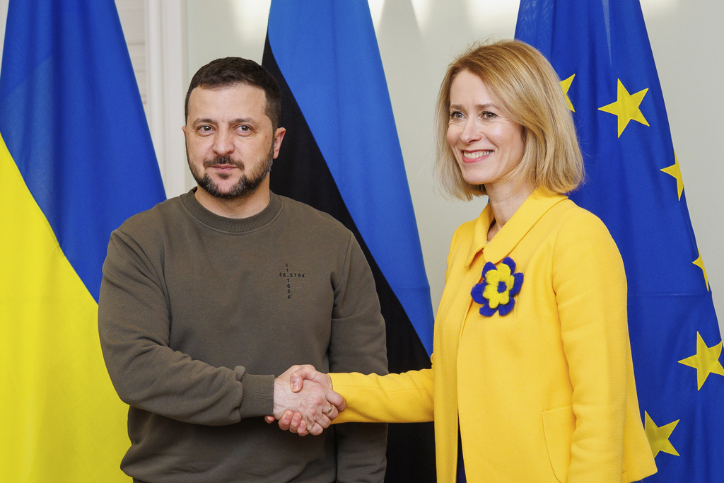 Estonia's Prime Minister Kaja Kallas, right, shakes hands with Ukrainian President Volodymyr Zelenskyy