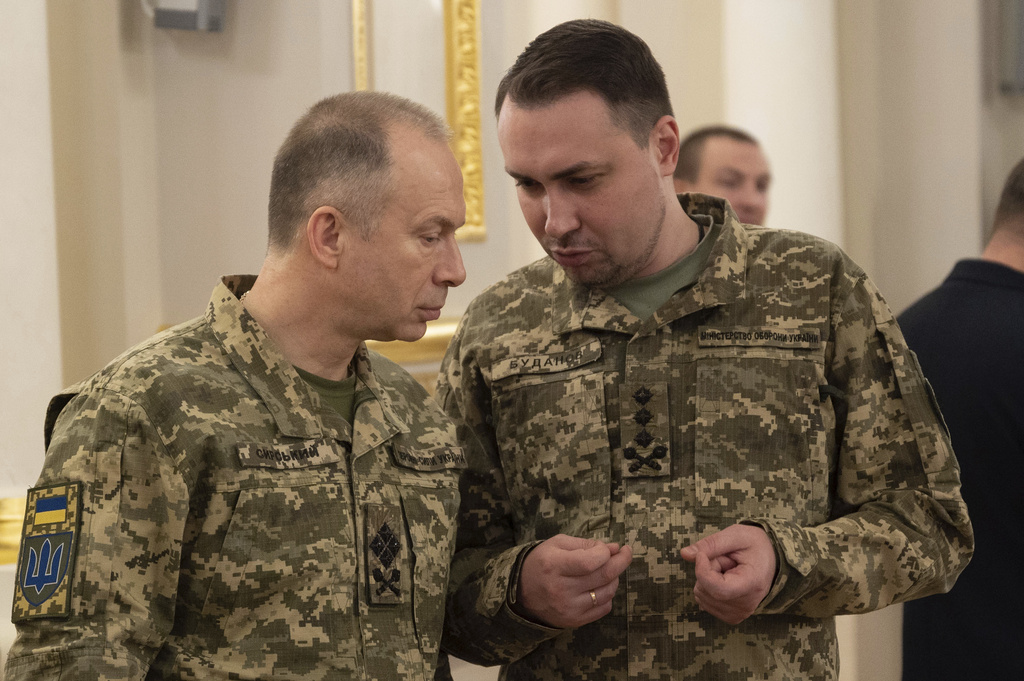 Newly appointed Commander-in-Chief of Ukraine's Armed Forces Oleksandr Syrsky, left, and Gen. Kyrylo Budanov, Ukraine's military intelligence chief talk during an awarding ceremony in Kyiv, Ukraine, Friday, Feb. 9, 2024