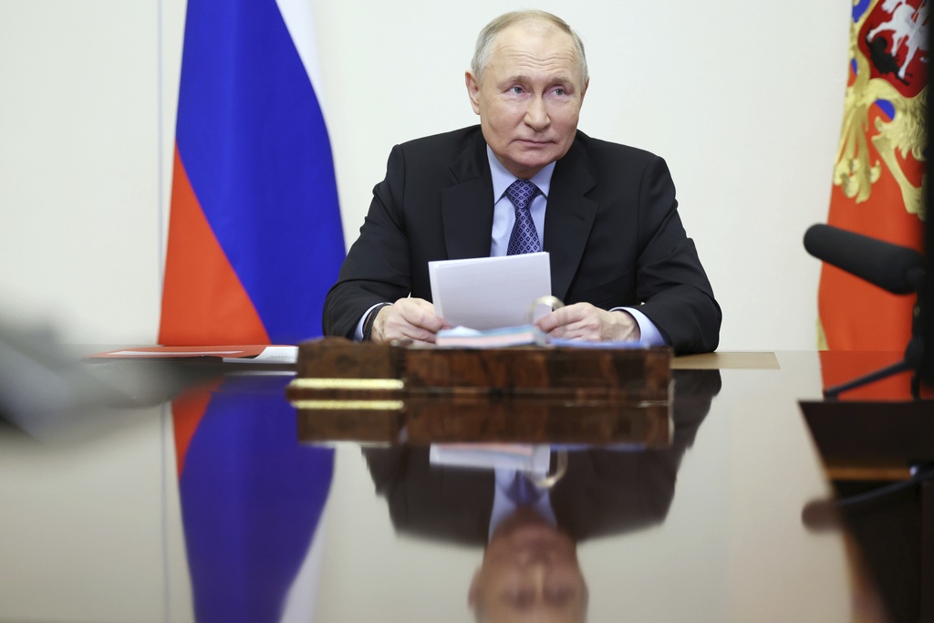 Russian President Vladimir Putin chairs the Security Council meeting via videoconference at the Novo-Ogaryovo State residence outside Moscow, Russia, Tuesday, Feb. 13, 2024